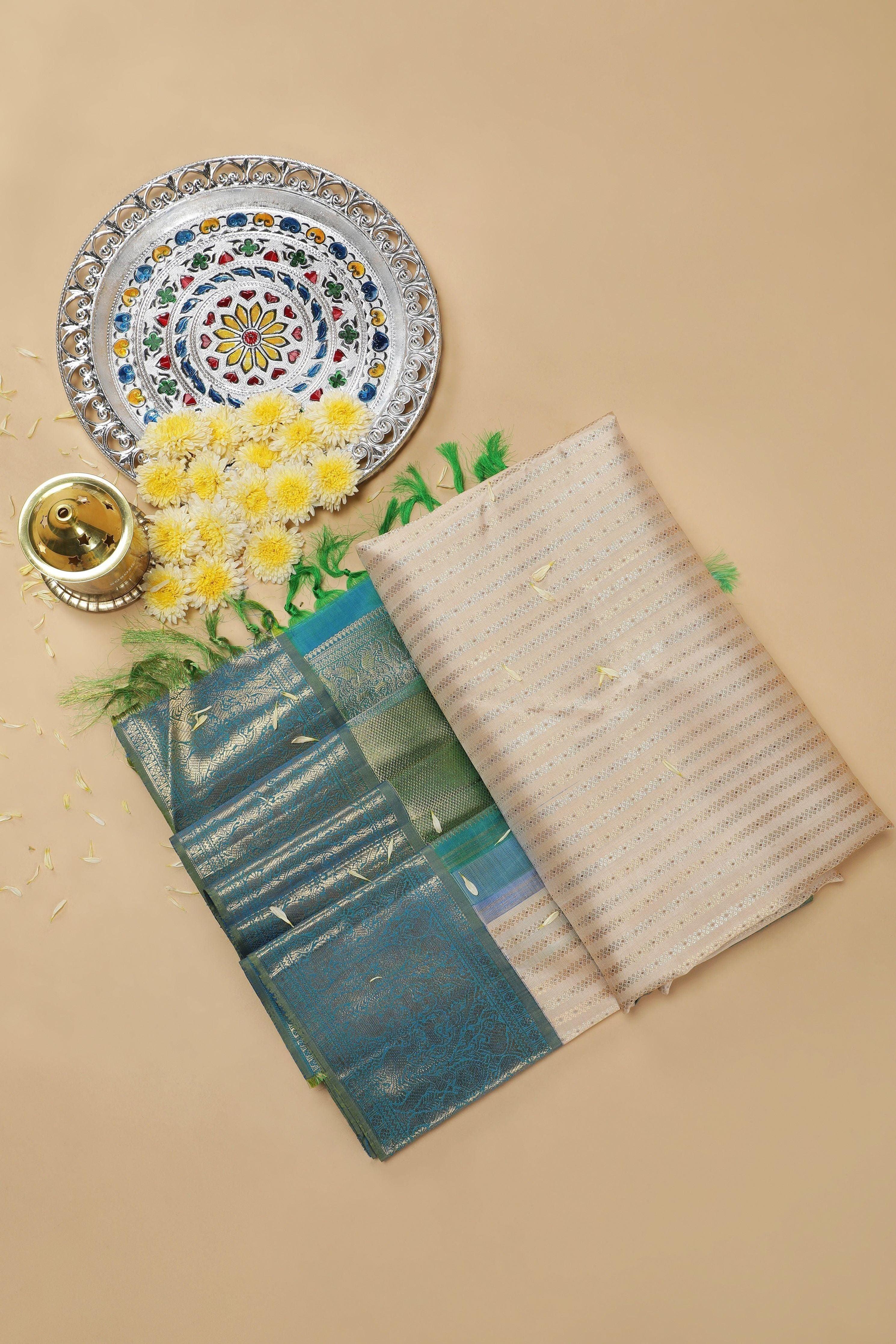 Ivory Kanchipuram Silk Saree with Peacock Blue Zari Border - Mokshaa