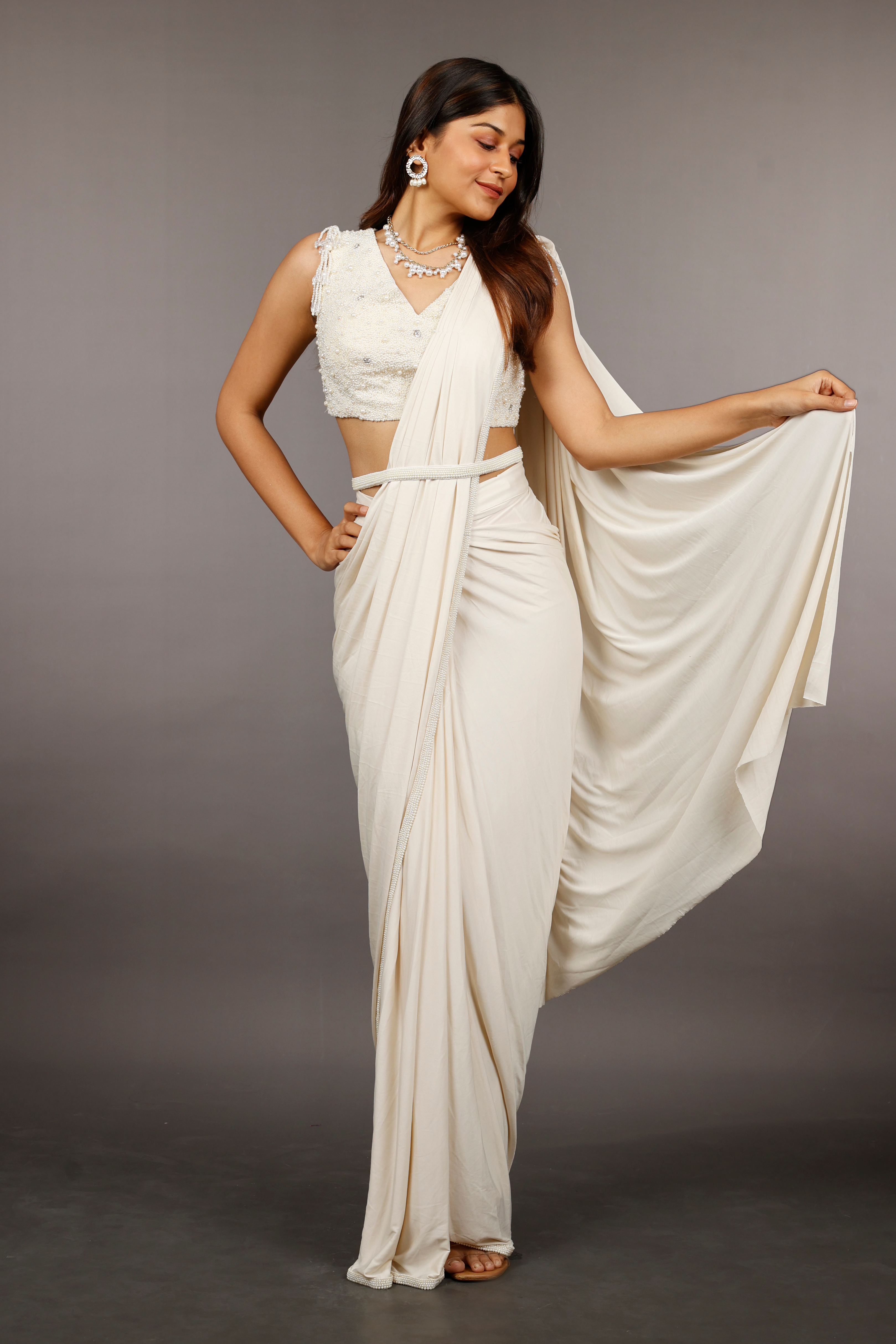 Ivory Lycra Drape Saree with Pearl & Stone Embroidered Blouse
