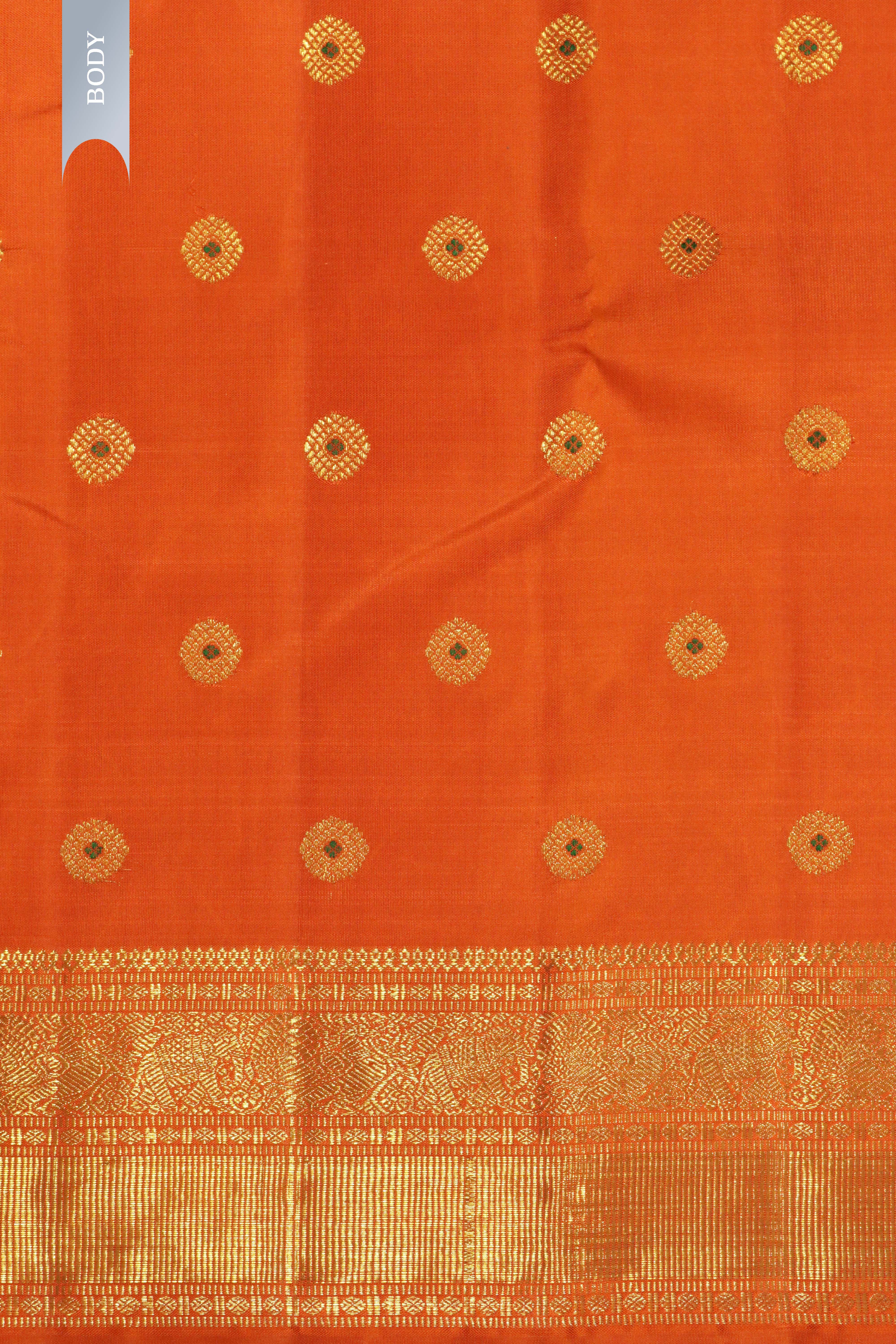 Orange Kanchipuram Silk Saree with All-Over Motifs and Zari Border