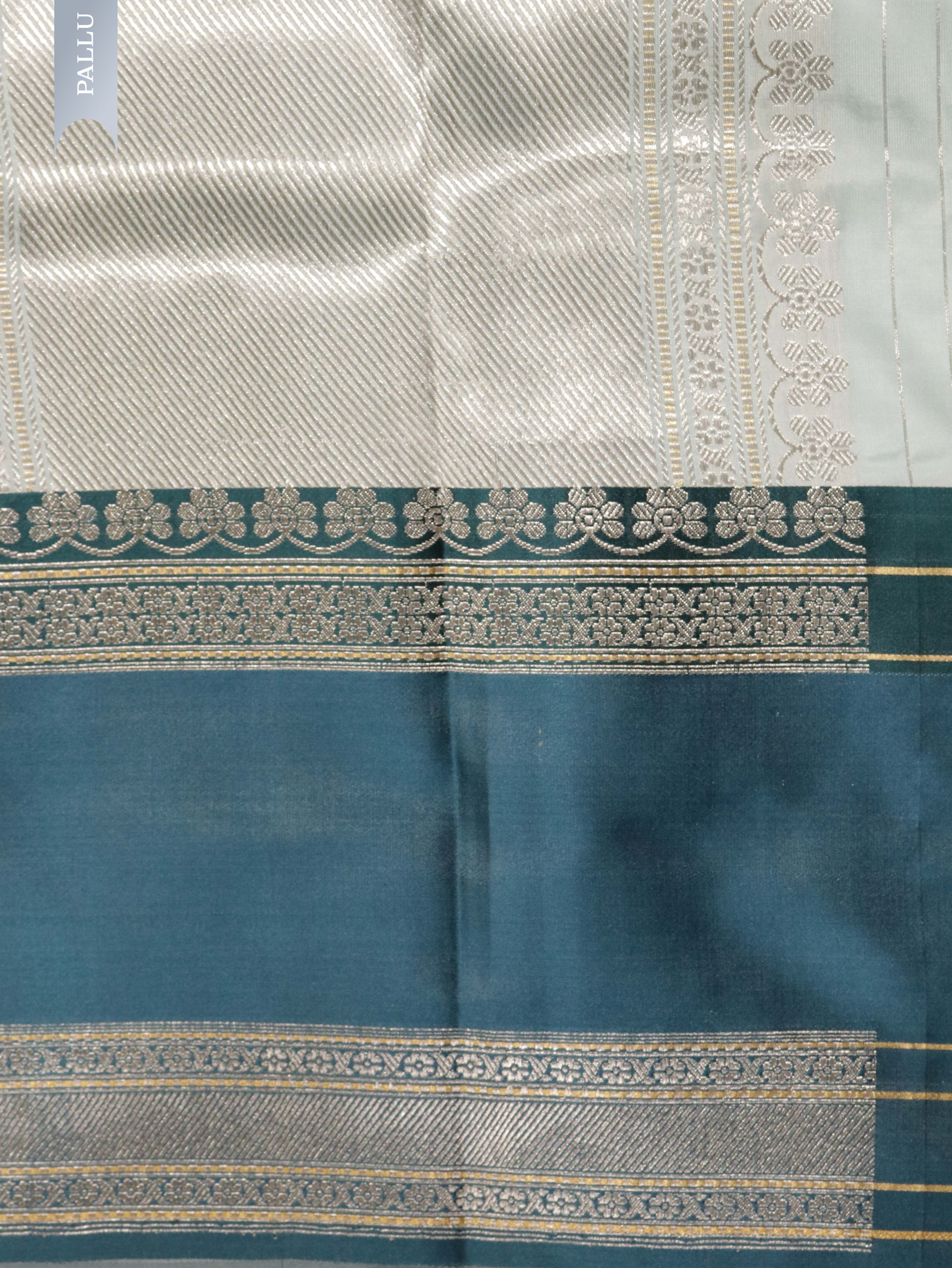Light Blue Banarasi Silk Saree with Silver–Gold Zig-Zag Weave & Contrast Satin Border