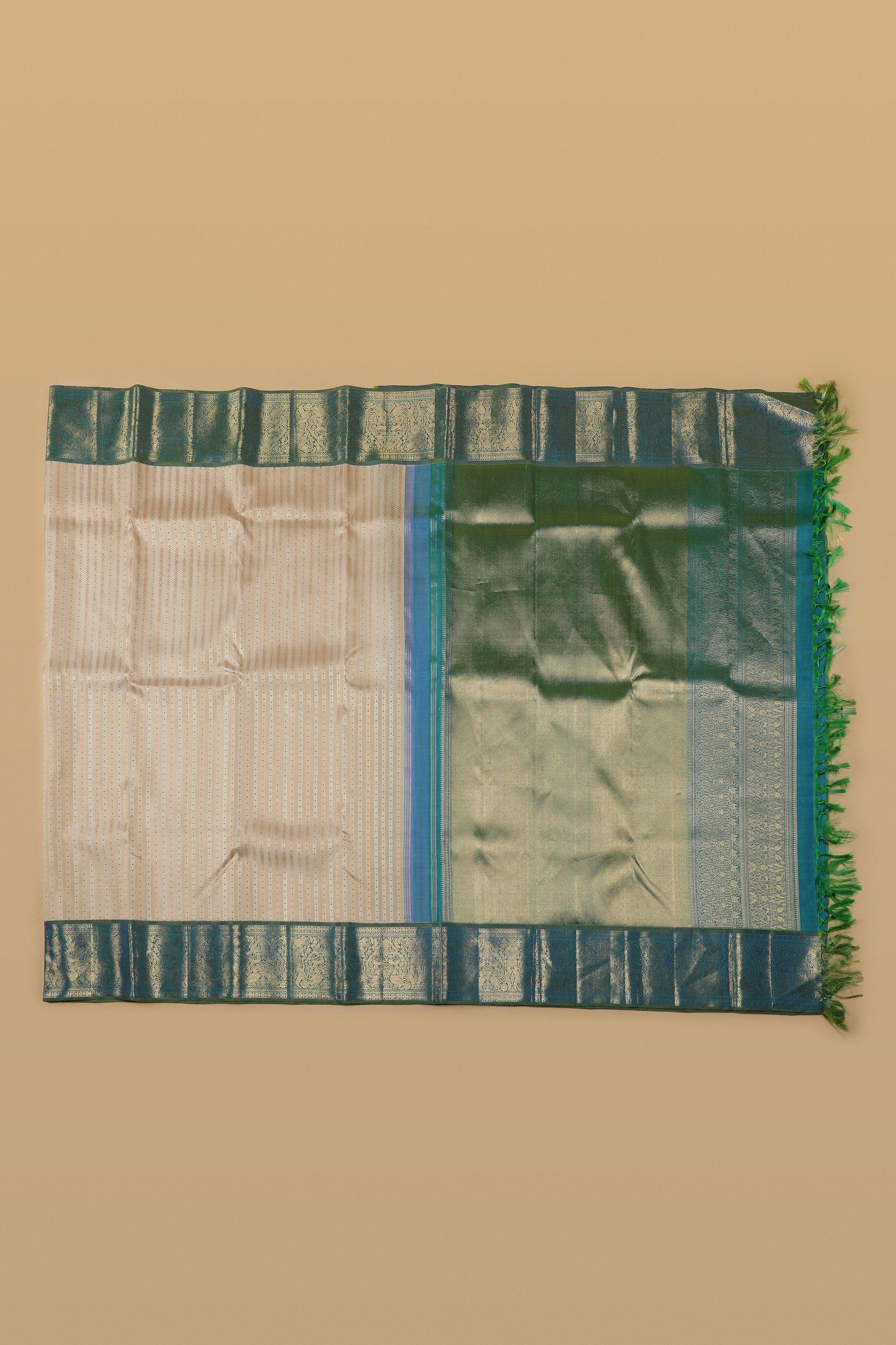 Ivory Kanchipuram Silk Saree with Peacock Blue Zari Border - Mokshaa