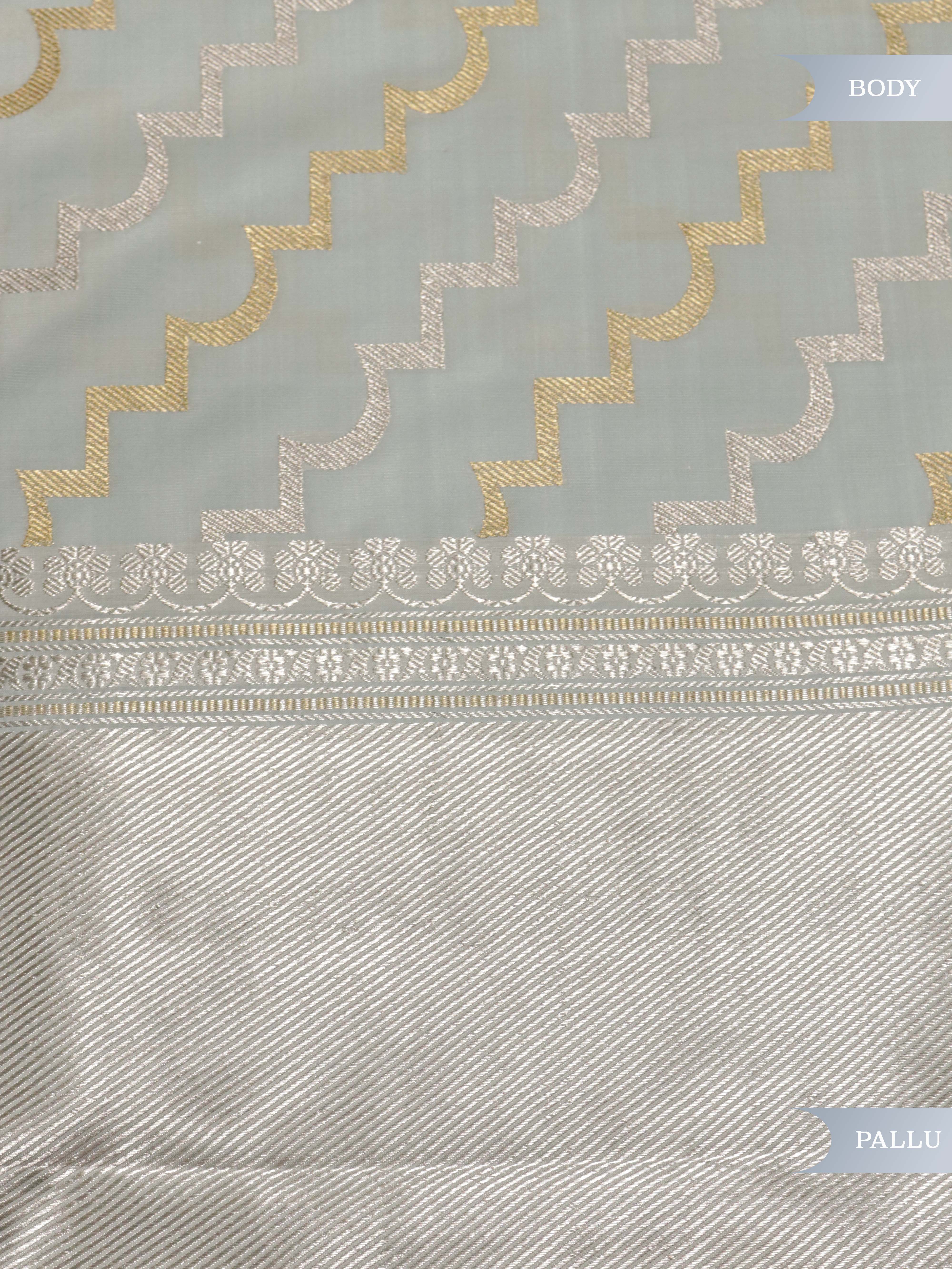 Light Blue Banarasi Silk Saree with Silver–Gold Zig-Zag Weave & Contrast Satin Border