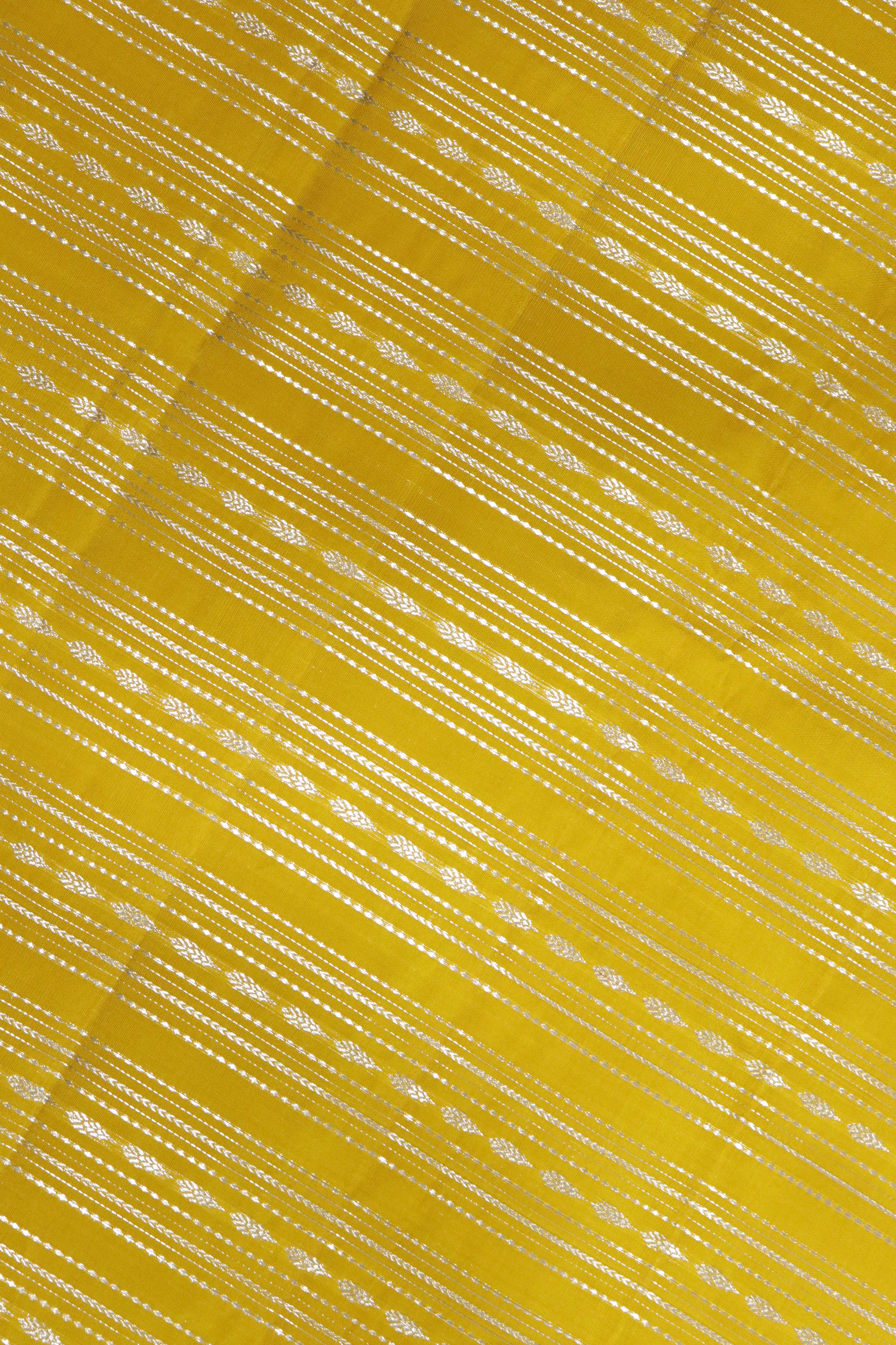 Yellow Kanchipuram Silk Saree with Silver Zari Horizontal Weaving Lines and Fancy Border