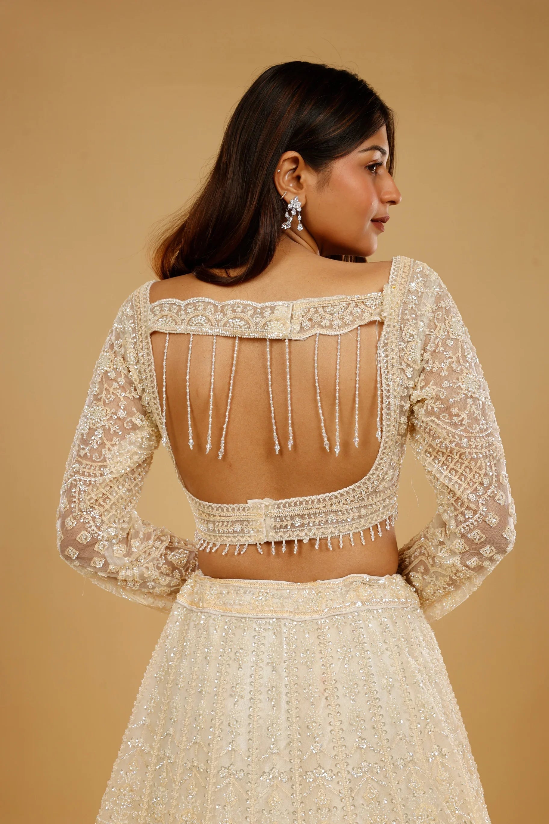 Ivory Gold Net Lehenga Set with Sequin, Cutdana & Pearl Embroidery - Mokshaa