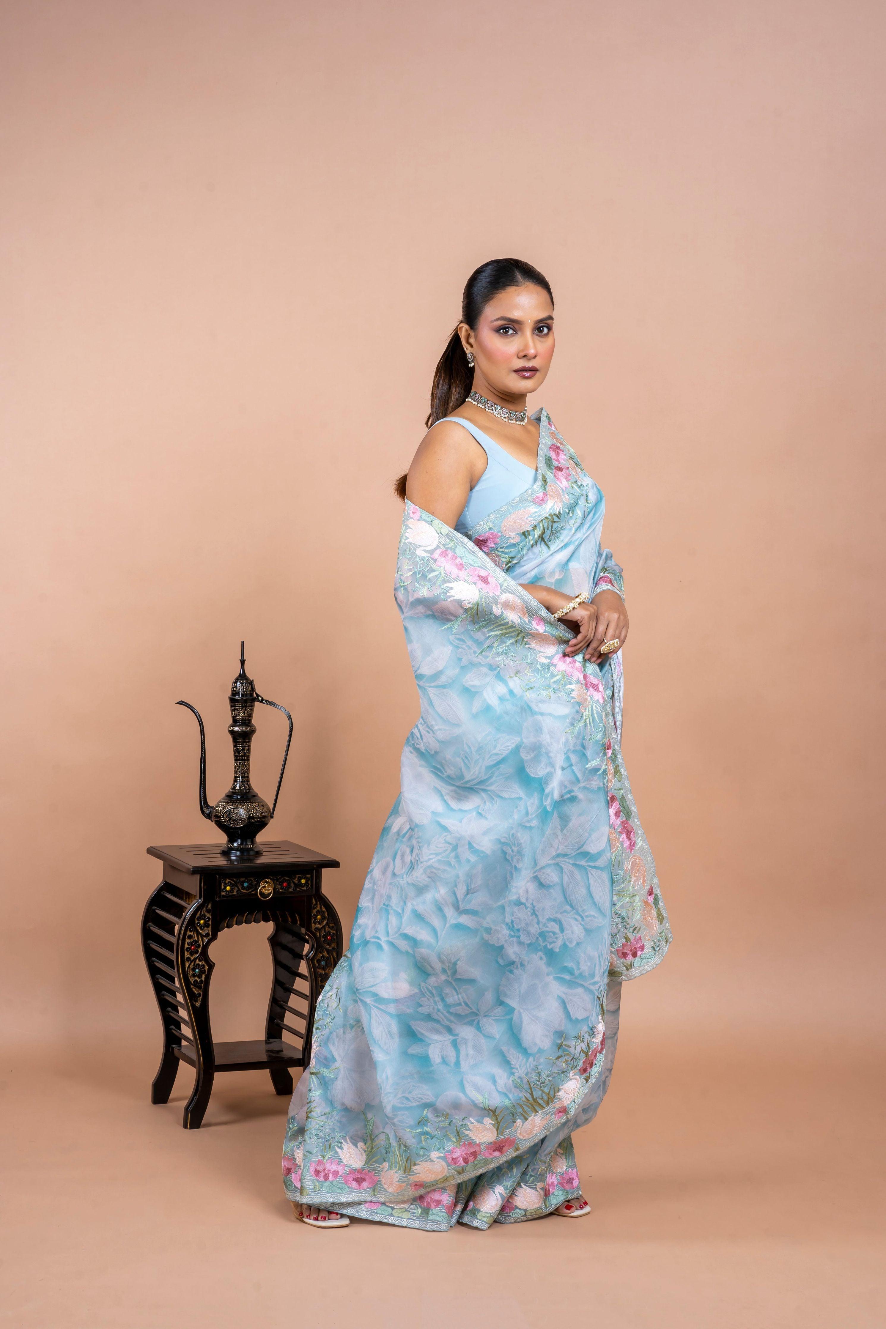 Sea Blue Organza Saree with Printed Body and Zari Border Mokshaa
