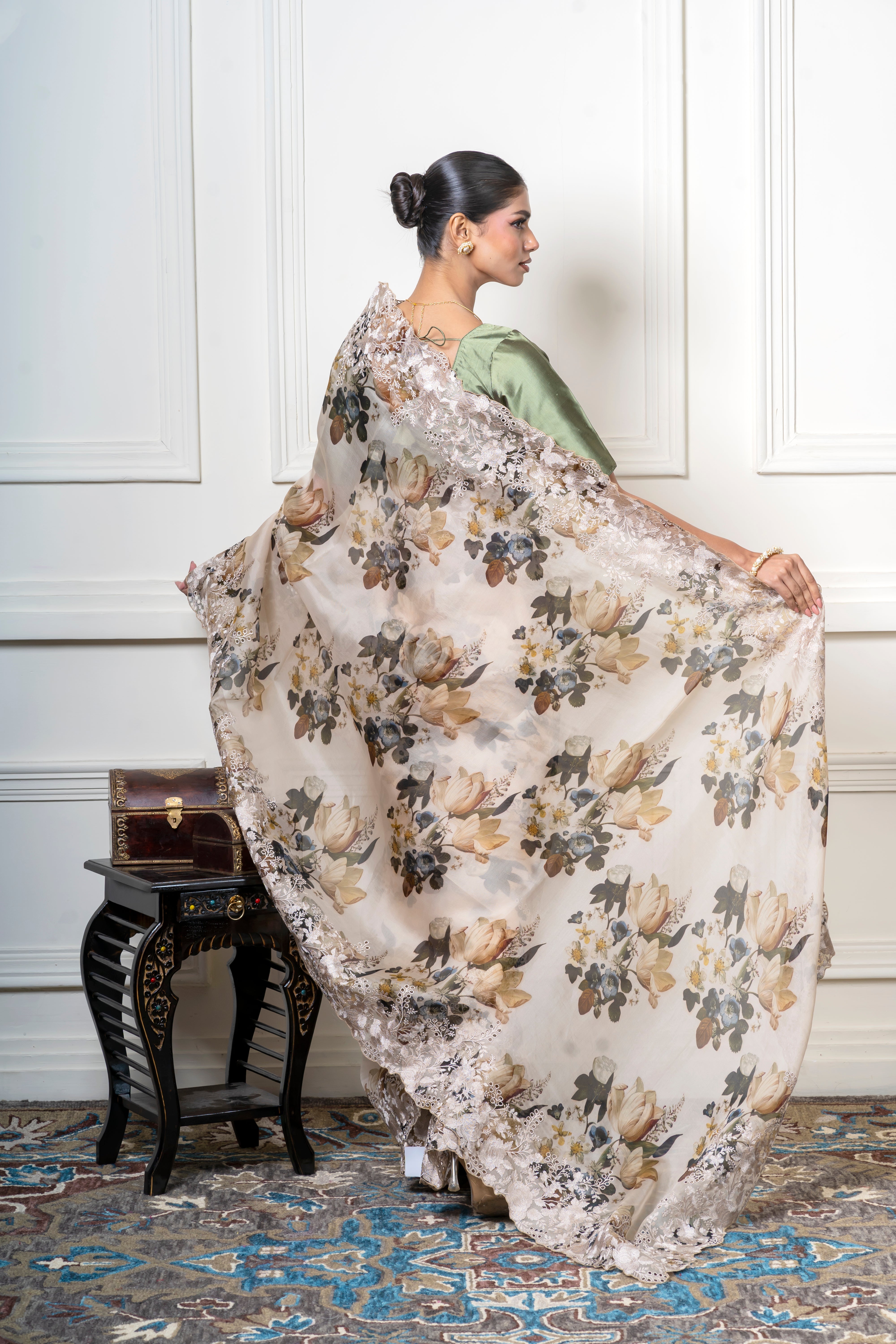 Ivory Organza Saree with Muted Floral Print and Lace BorderĀ Mokshaa