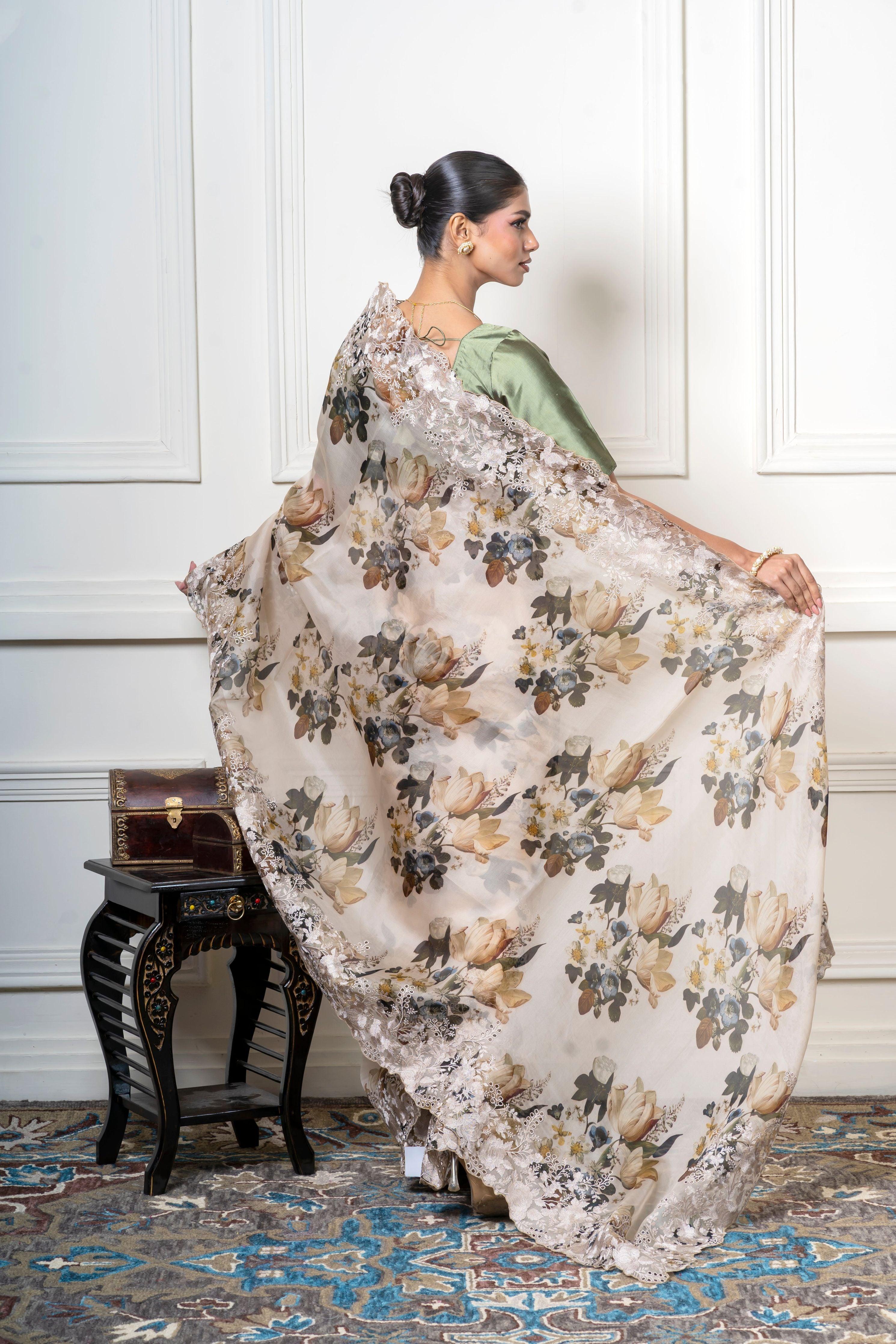 Ivory Organza Saree with Muted Floral Print and Lace Border Mokshaa