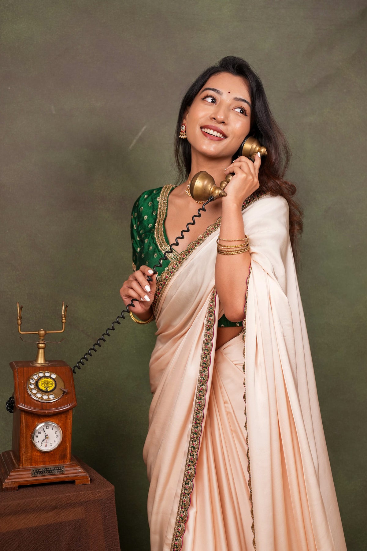 Peach Satin Saree with Green Embroidered Border