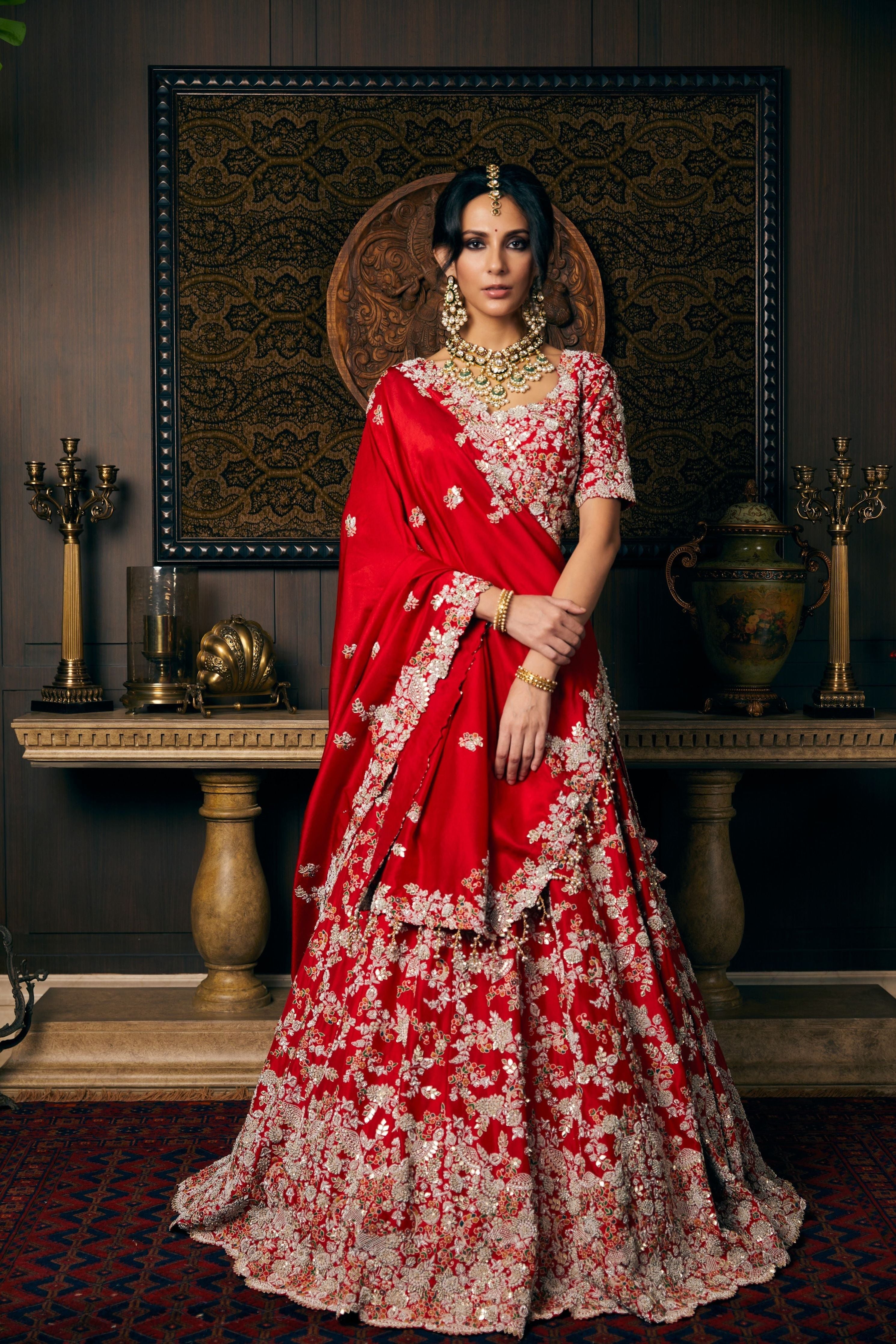 Blood red silk lehenga and blouse with organza dupatta and veil Mokshaa