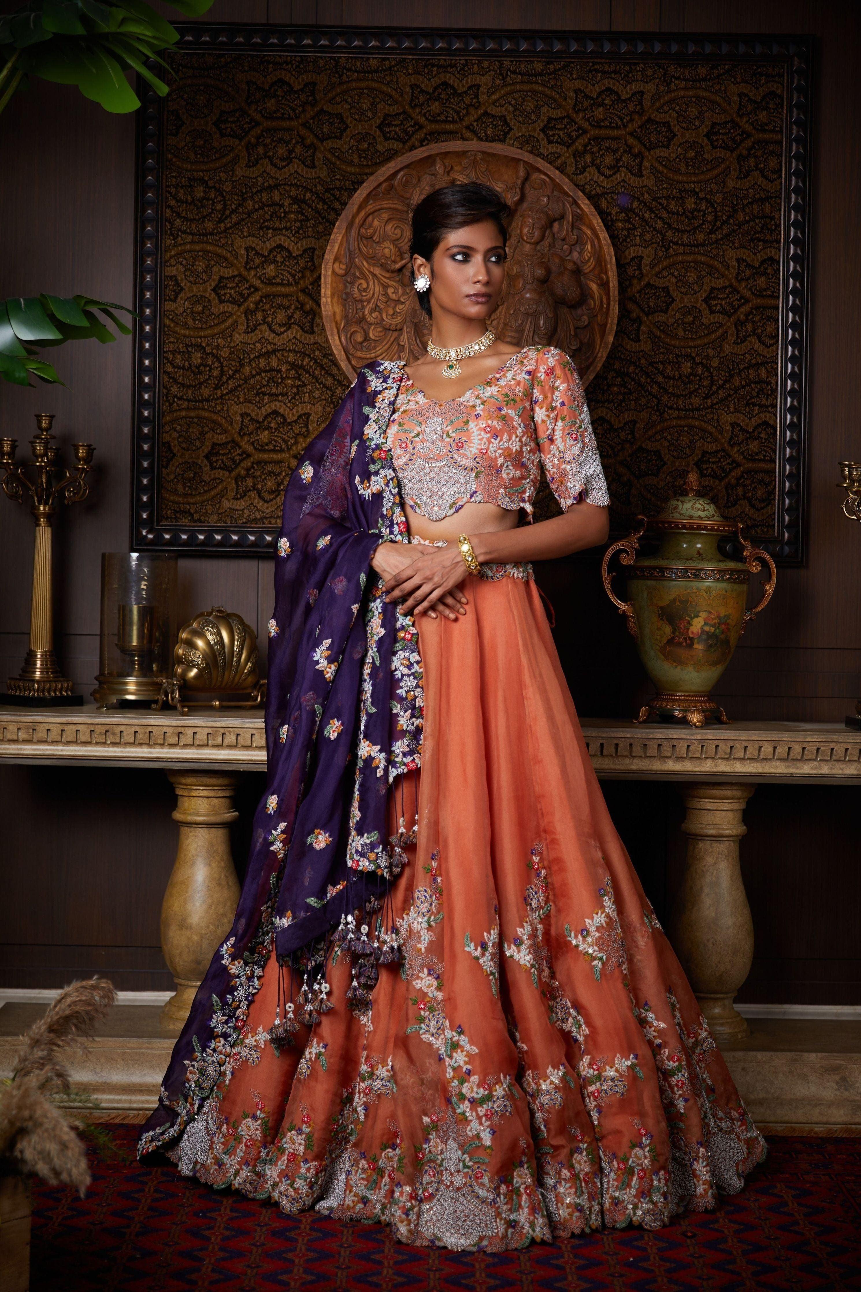 Rust organza lehenga and aubergine organza dupatta with silk blouse Mokshaa