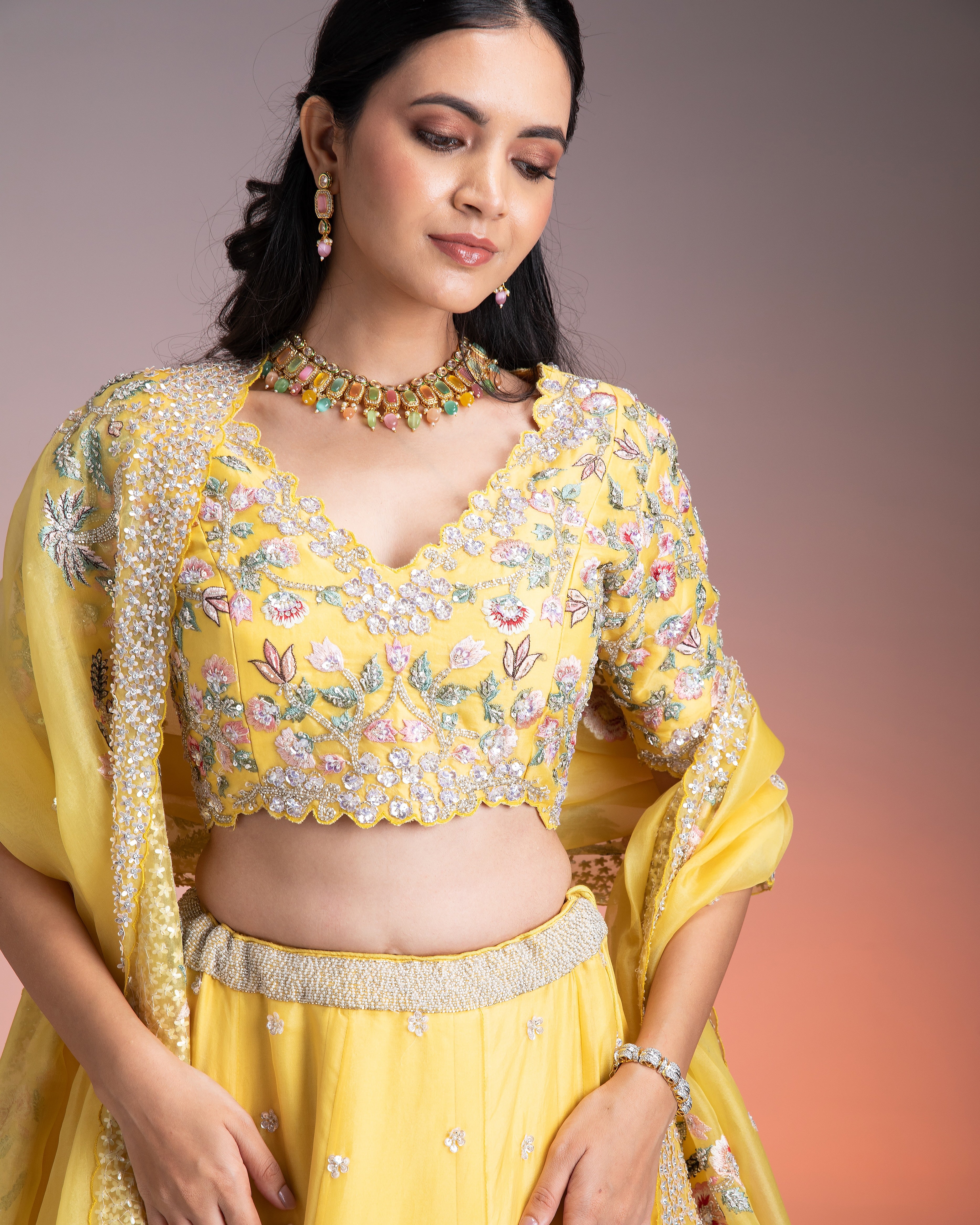 Vibrant Yellow Organza Lehenga with Multicolor Floral Threadwork and Sequins Mokshaa