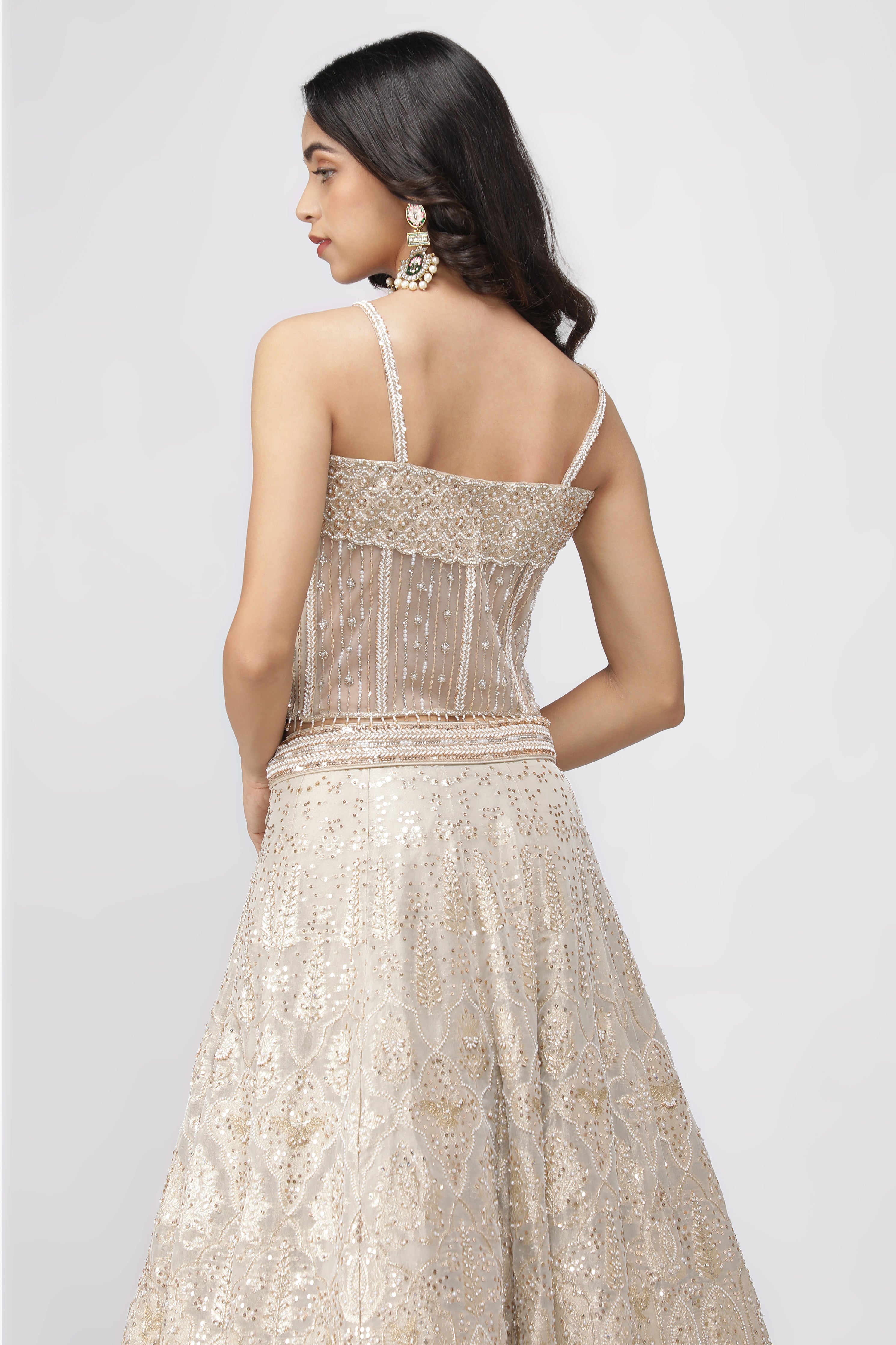 Ivory Banarasi Tissue Lehenga with Pearl Embellished Corset Blouse