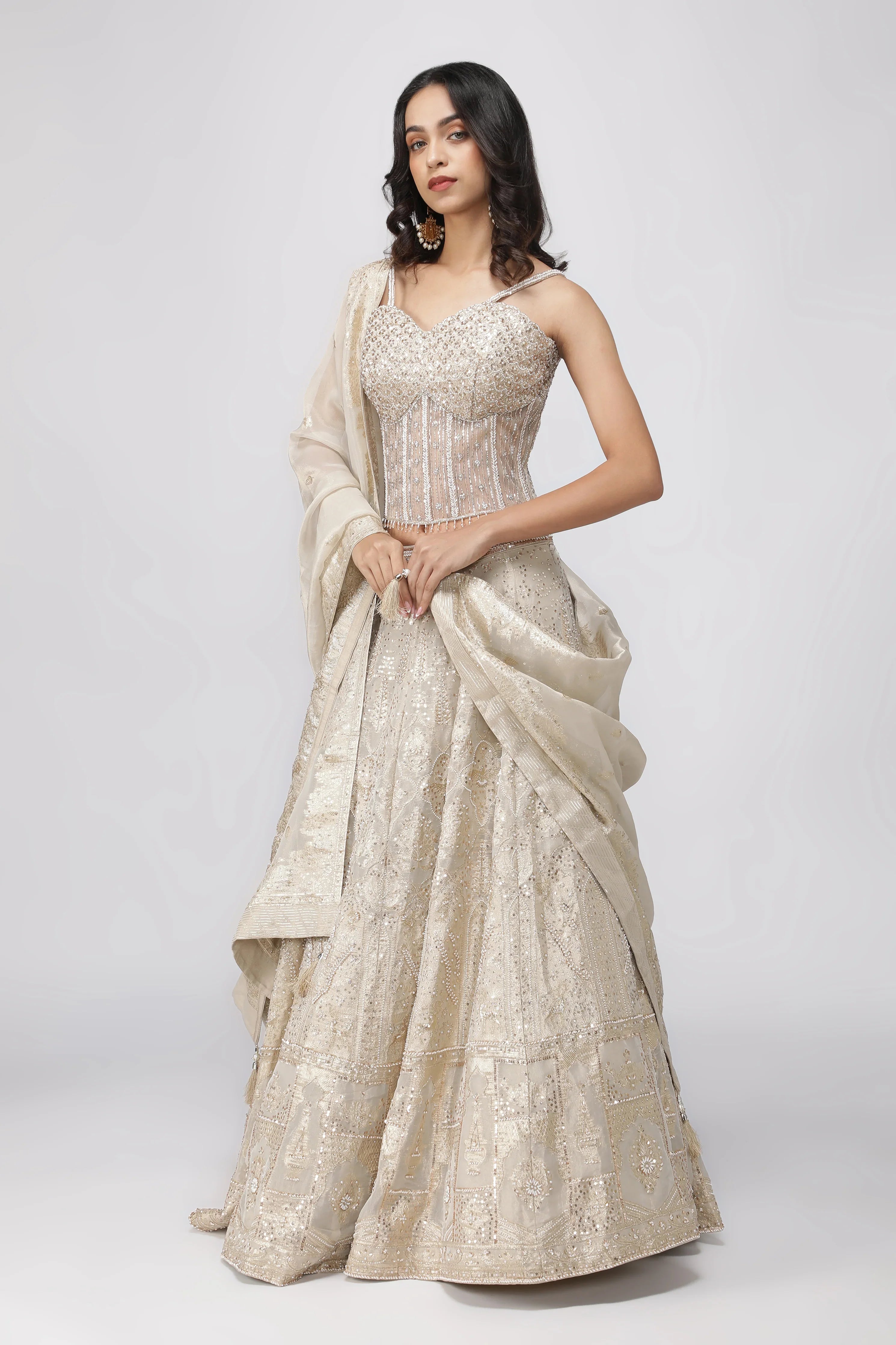 Ivory Banarasi Tissue Lehenga with Pearl Embellished Corset Blouse | Mokshaa