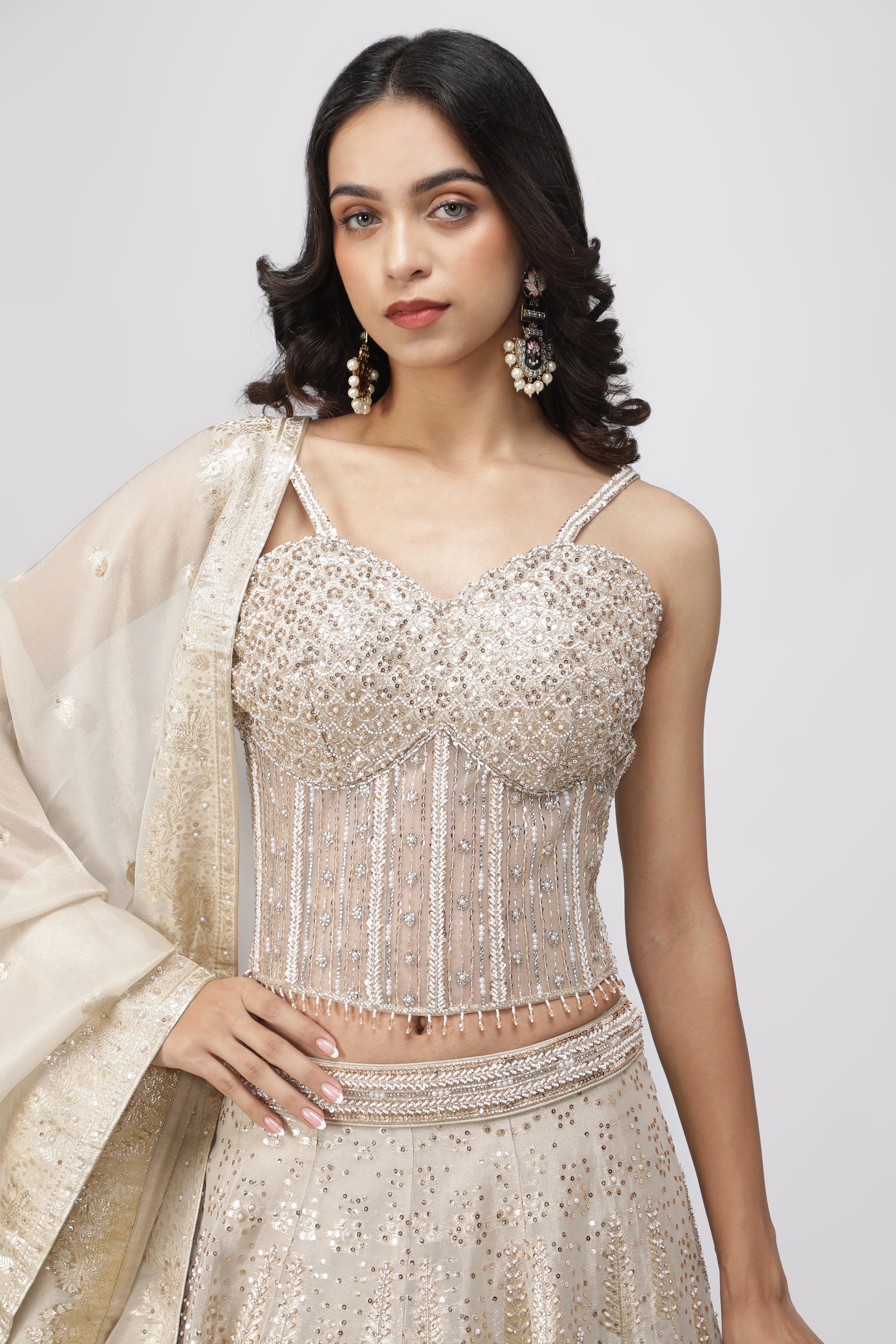 Ivory Banarasi Tissue Lehenga with Pearl Embellished Corset Blouse