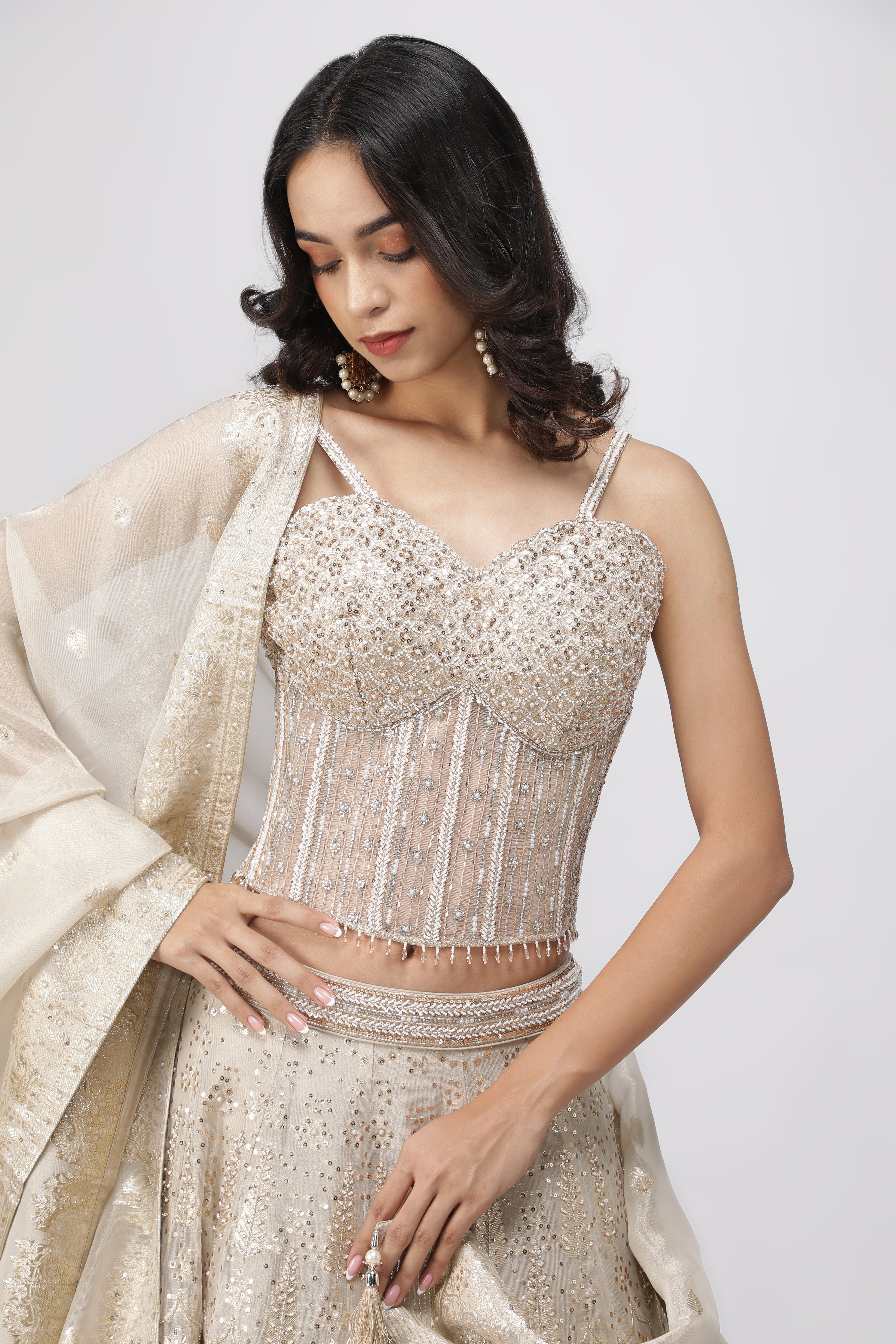 Ivory Banarasi Tissue Lehenga with Pearl Embellished Corset Blouse