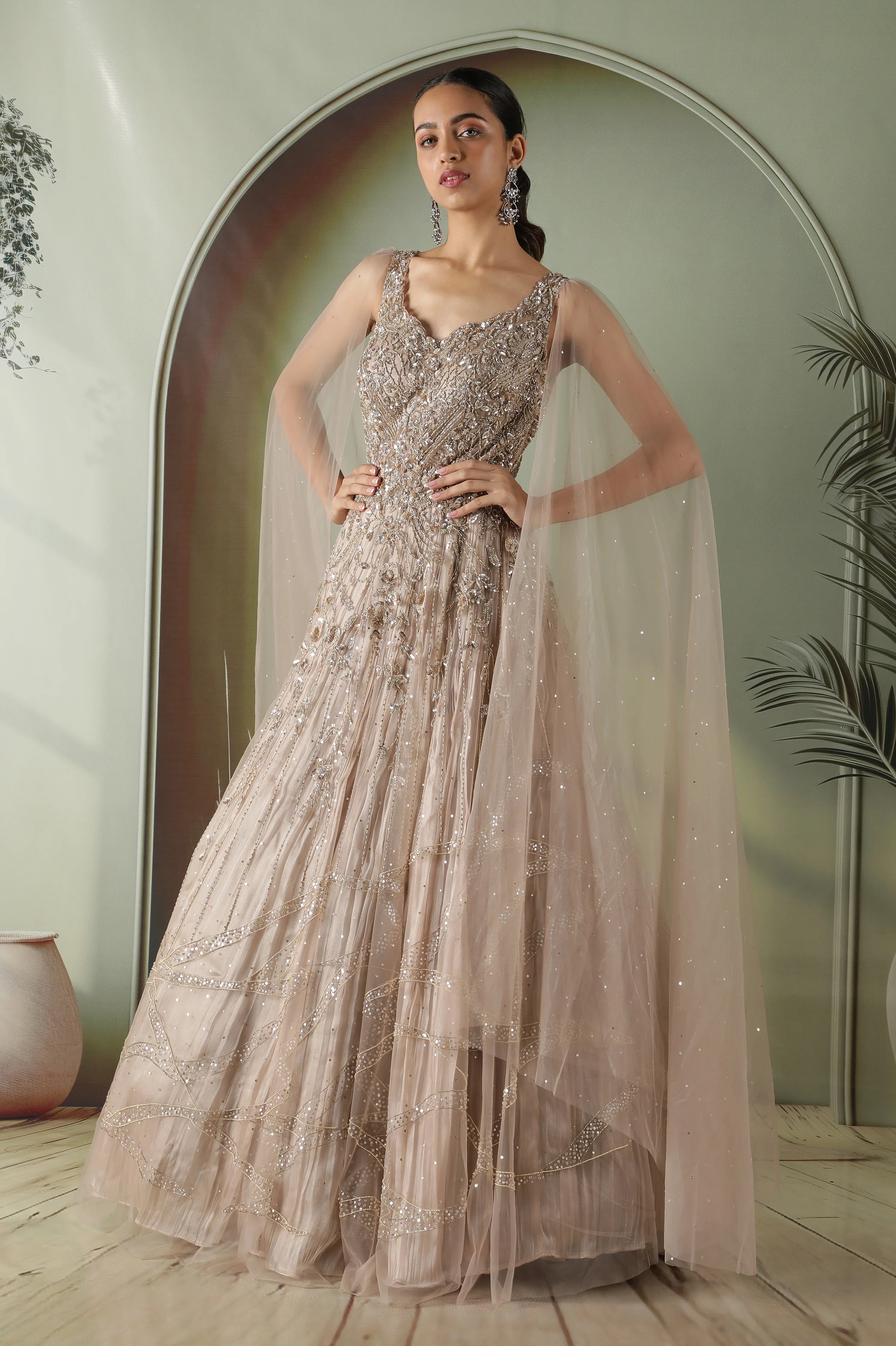 Dark Gold Embroidered Gown with Tissue Lining and Cape Sleeves | Mokshaa