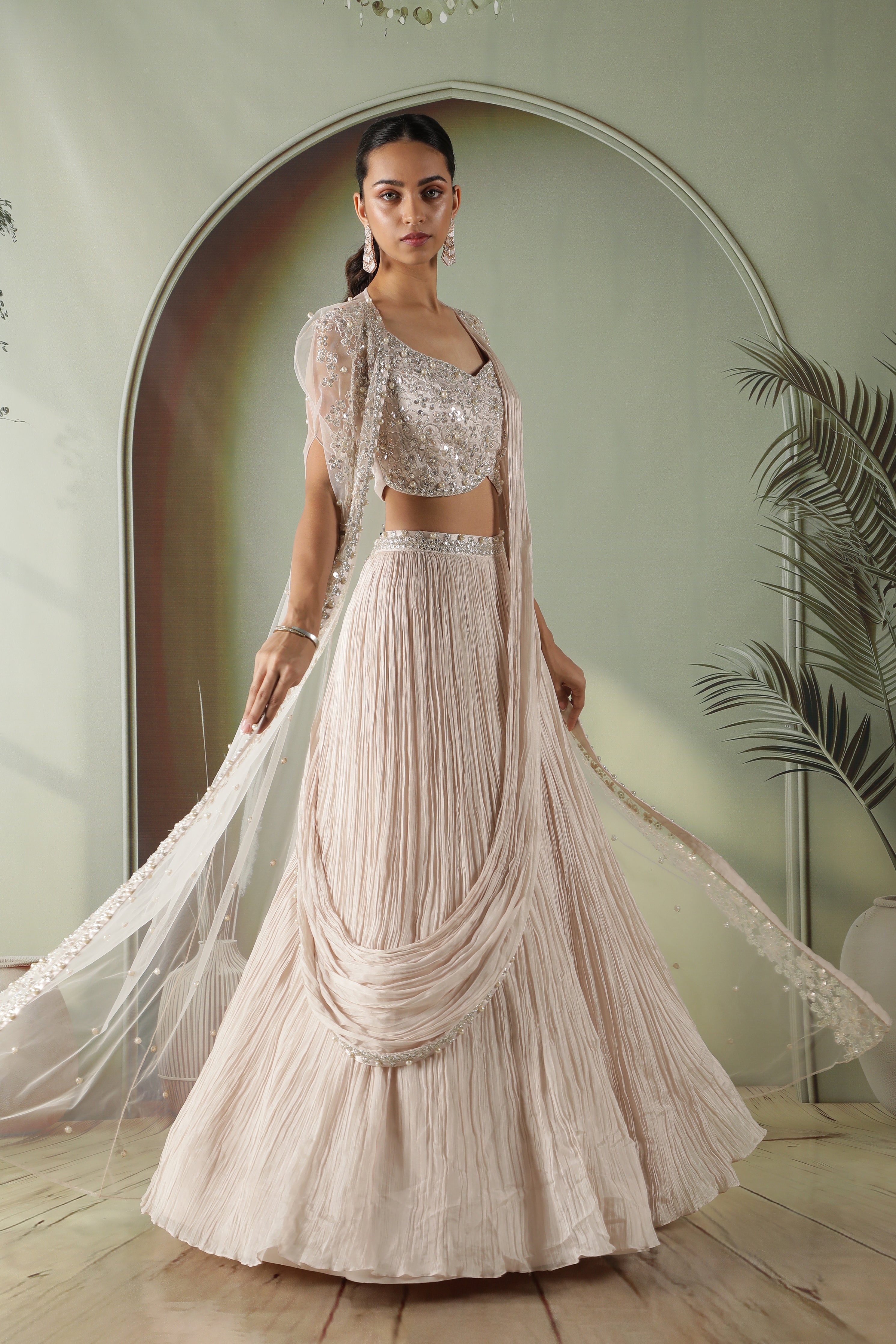 Ivory Silk Lehenga with Draped Dupatta and Embellished Net Cape
