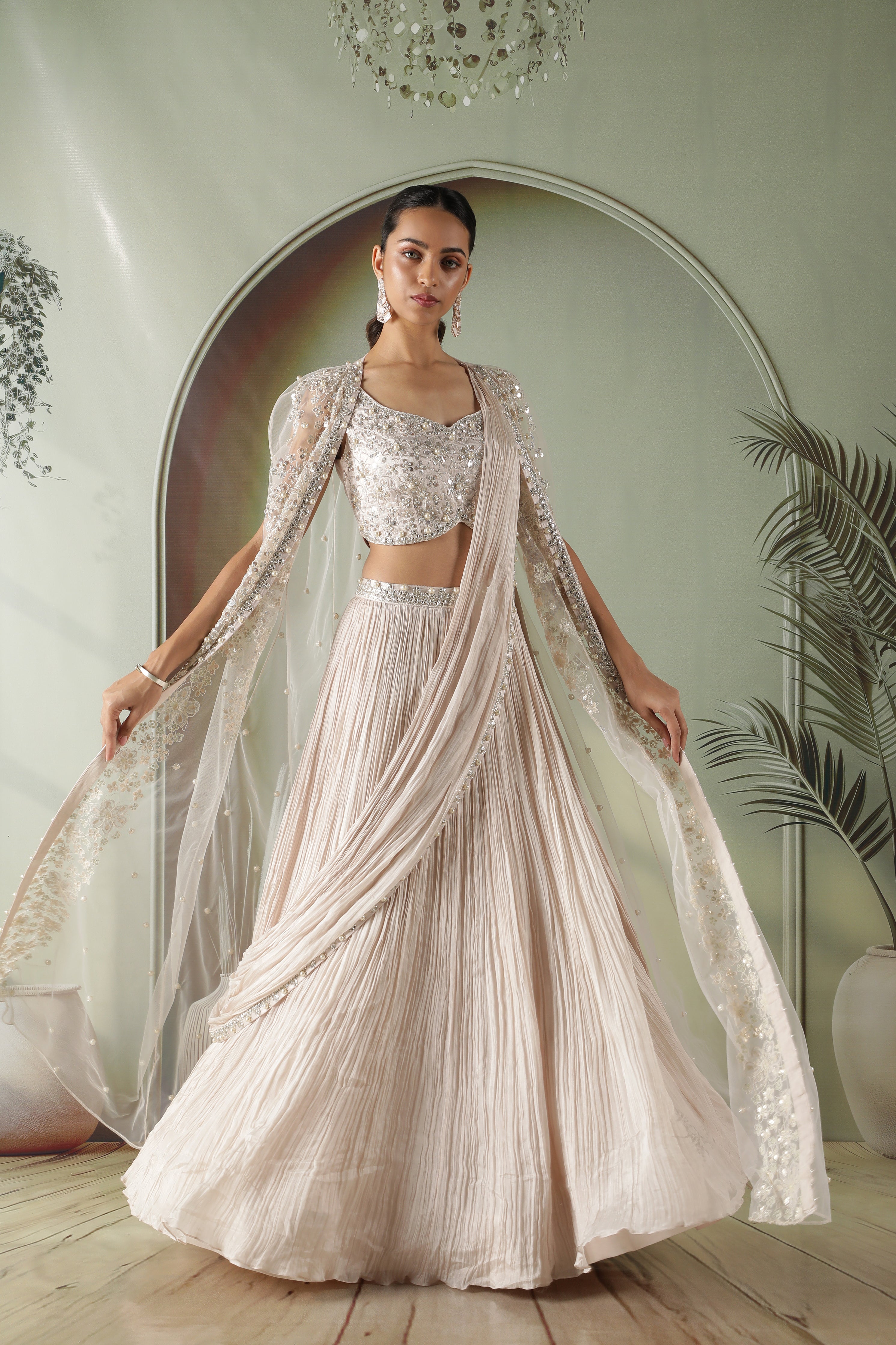 Ivory Silk Lehenga with Draped Dupatta and Embellished Net Cape