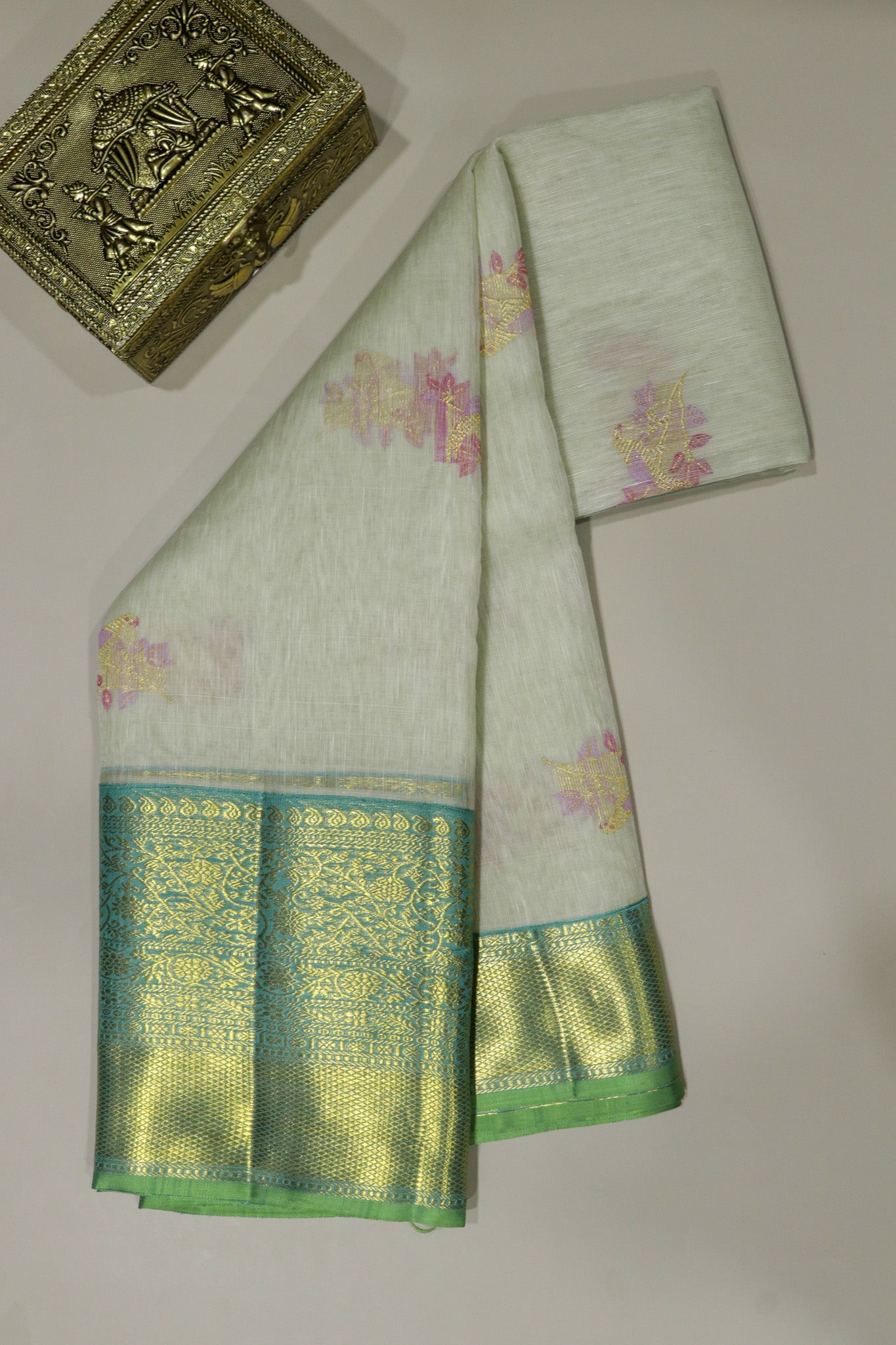 Off White Kanchivaram Silk Saree with Meenakari Parrot Motifs and Contrast Teal Zari Border