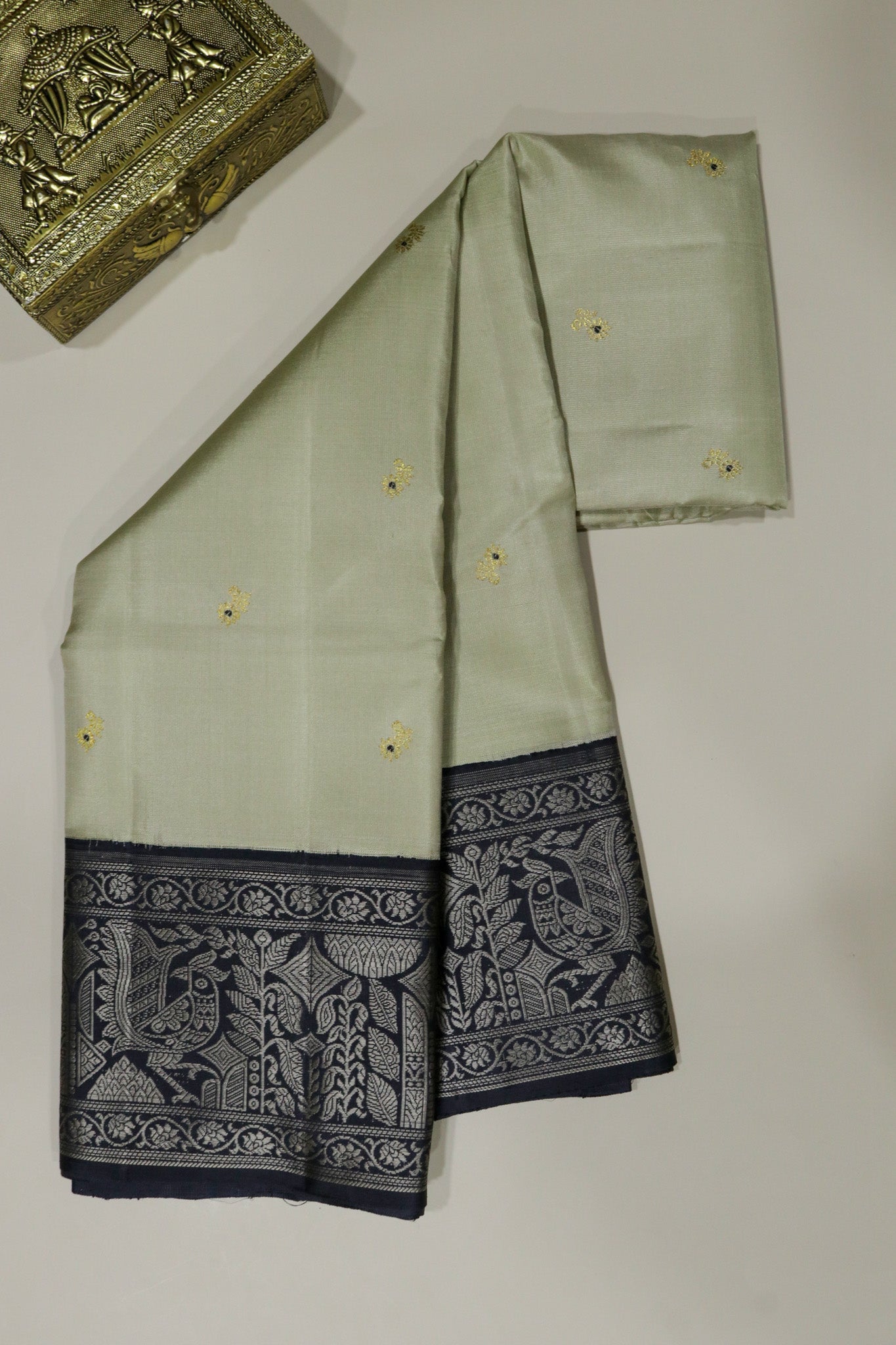 Beige Kanchivaram Silk Saree with Black Contrast Border and Traditional Thread Weaving