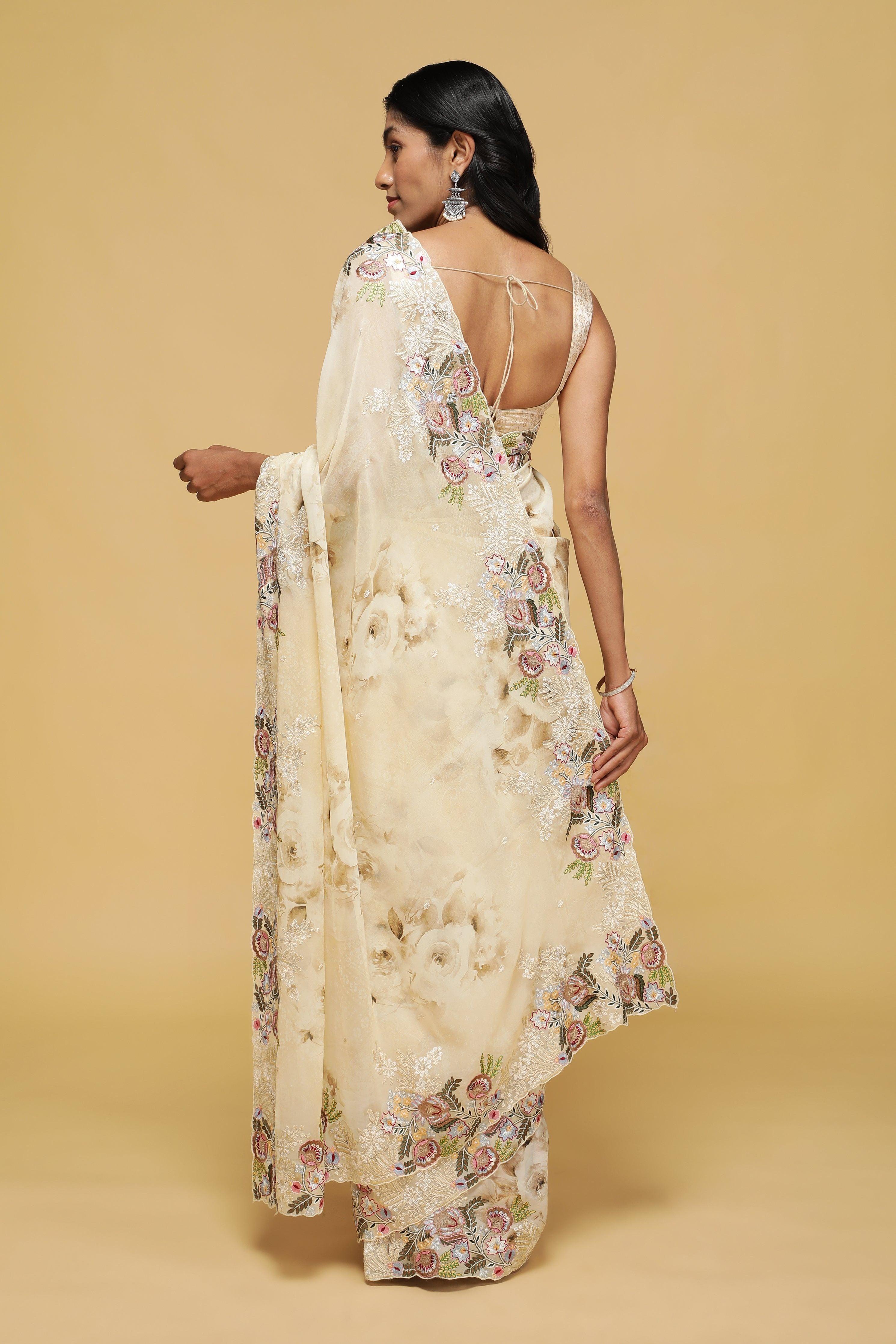 Beige Floral Georgette Saree with Multi-Thread Embroidered Border.