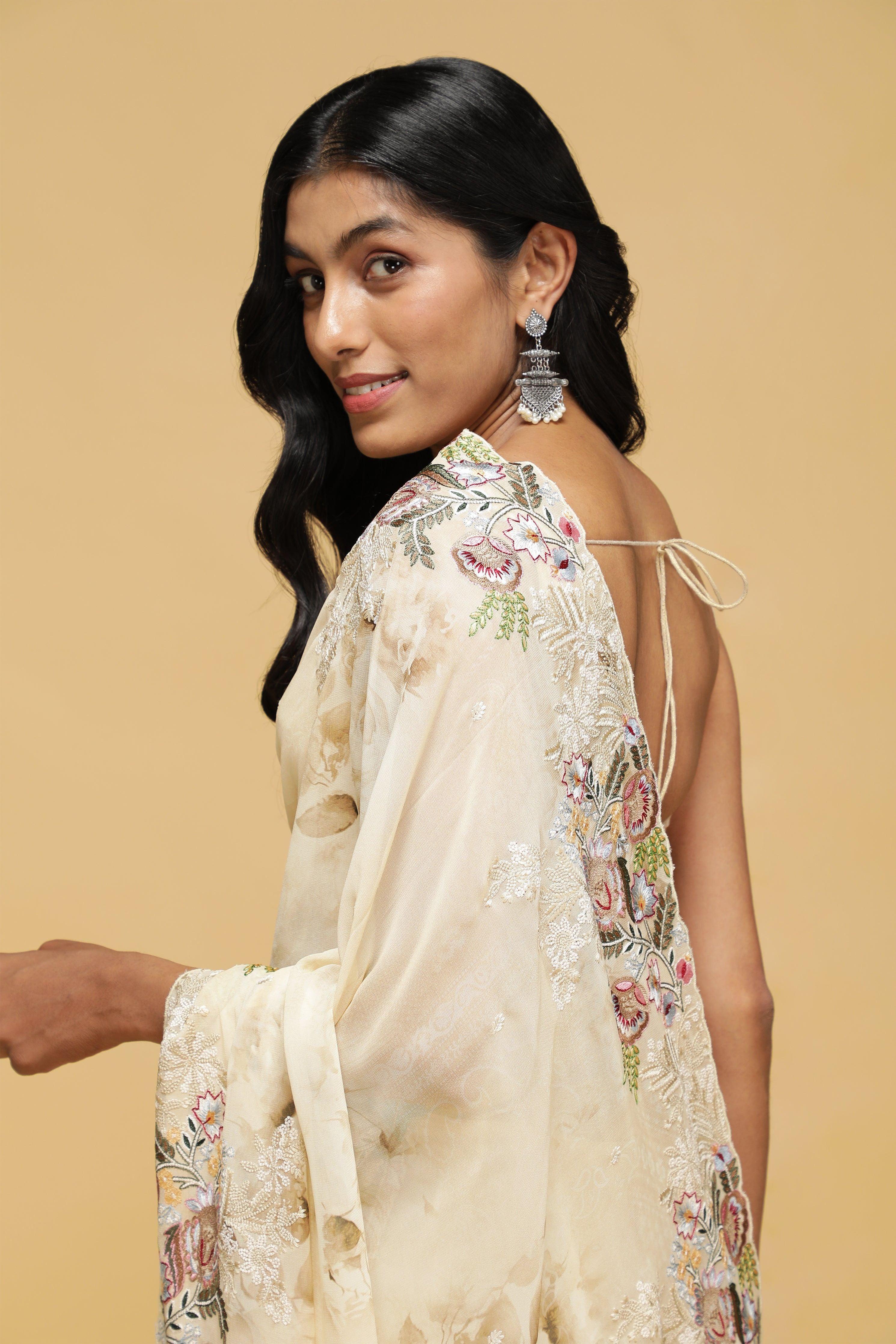Beige Floral Georgette Saree with Multi-Thread Embroidered Border.