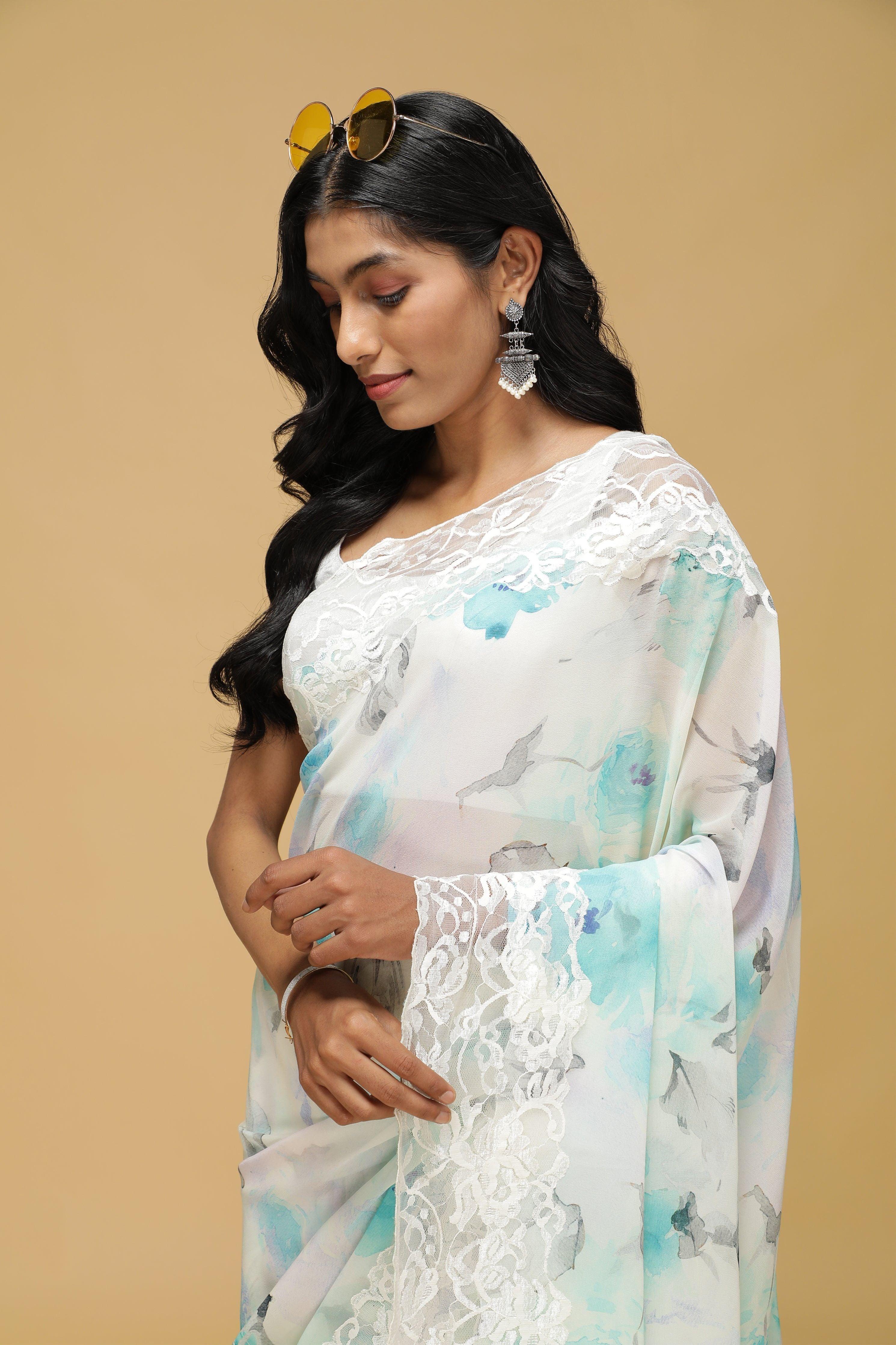Off-White Floral Georgette Saree with Scalloped Lace Border.
