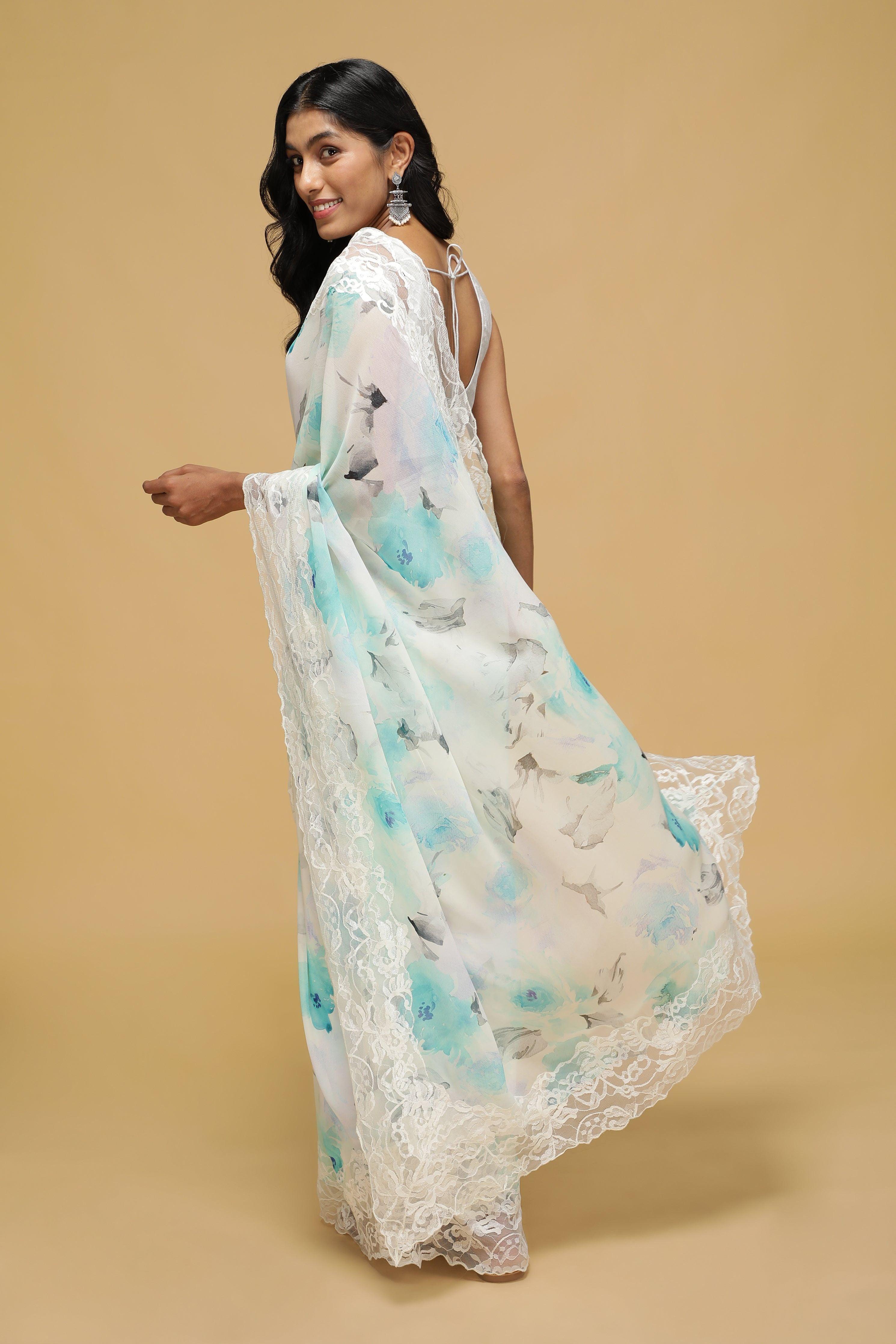Off-White Floral Georgette Saree with Scalloped Lace Border.