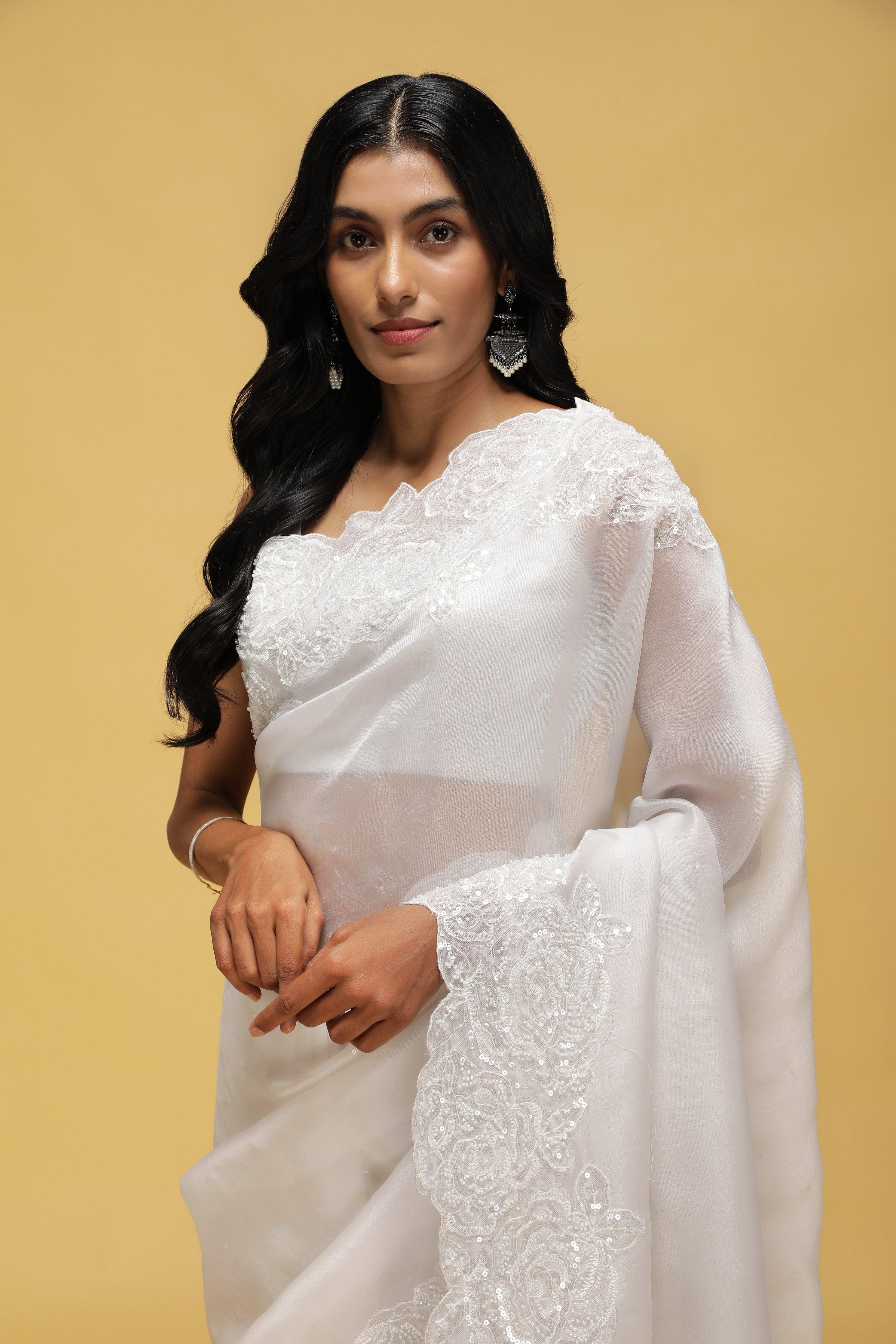 Off-White Organza Saree with Sequin & Thread Border.
