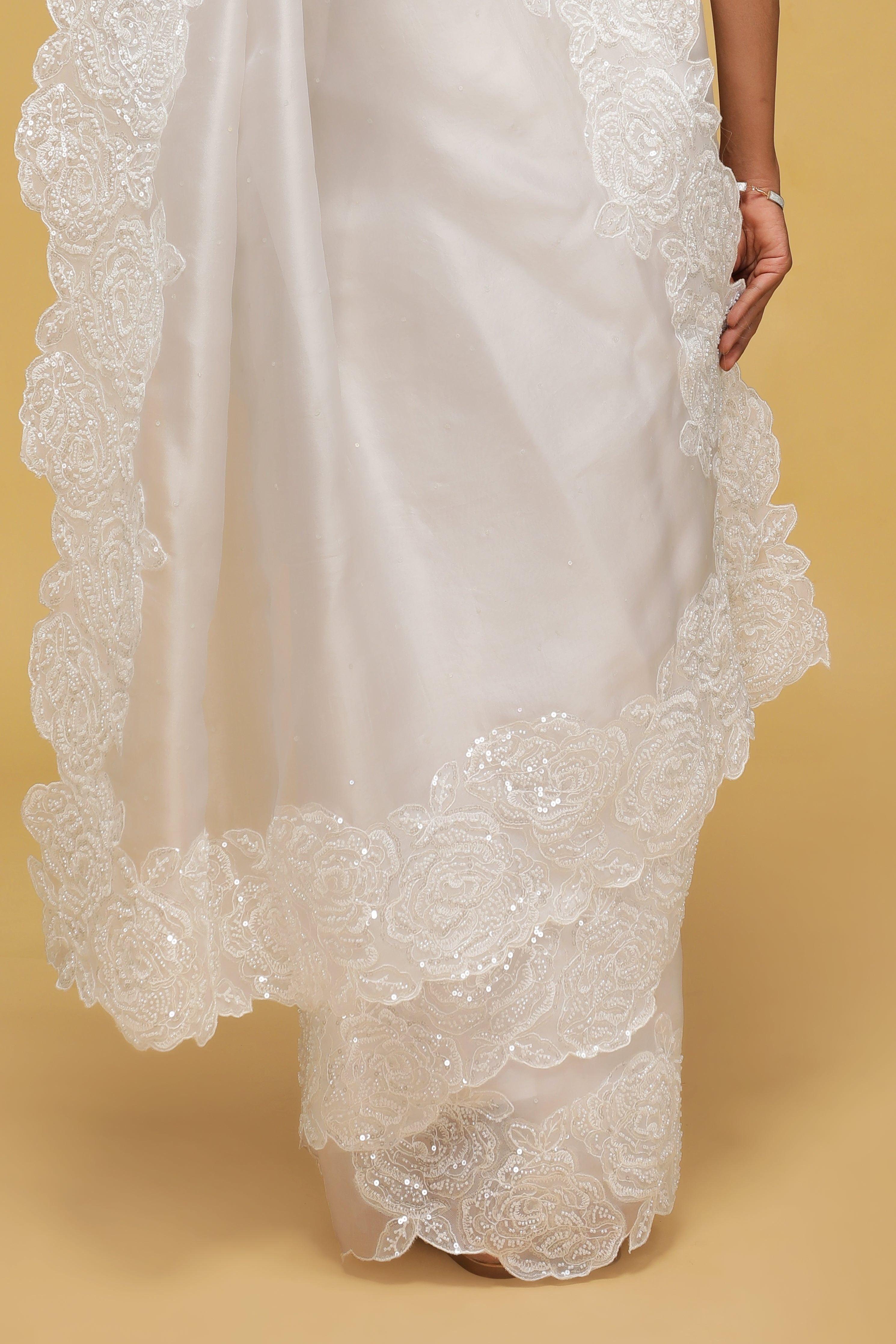 Off-White Organza Saree with Sequin & Thread Border.
