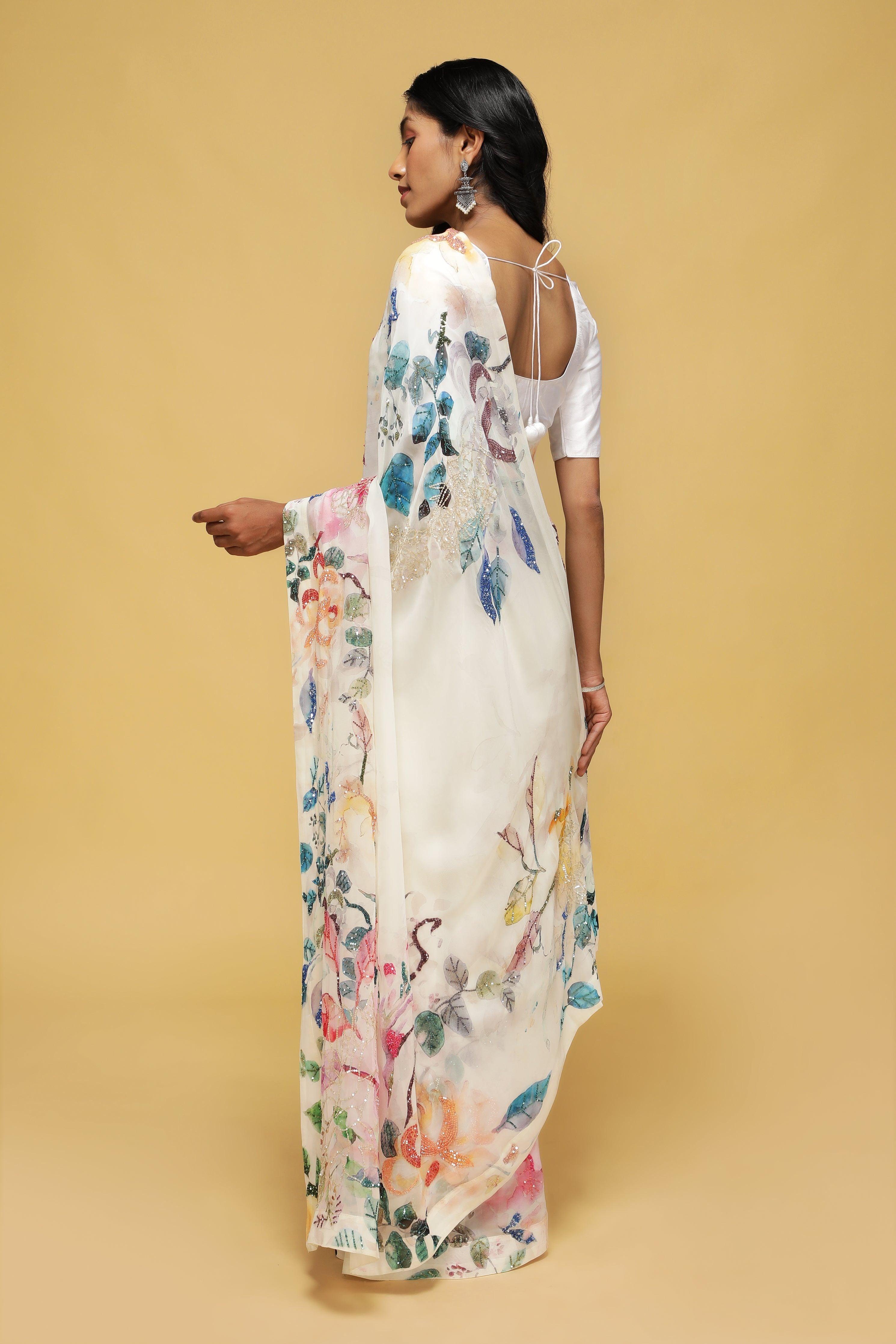 Off-White Georgette Saree with Printed Sequin Border.