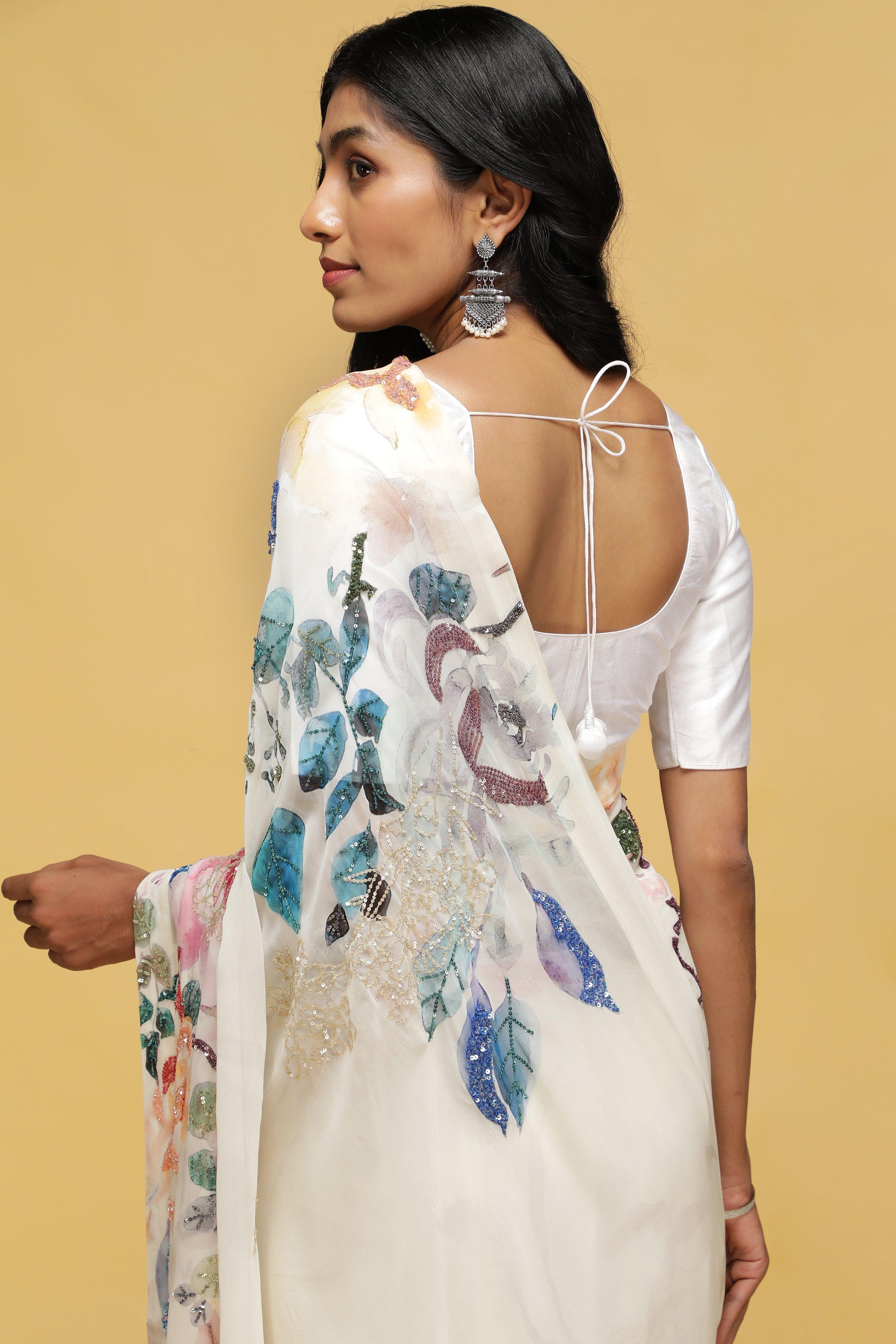 Off-White Georgette Saree with Printed Sequin Border.