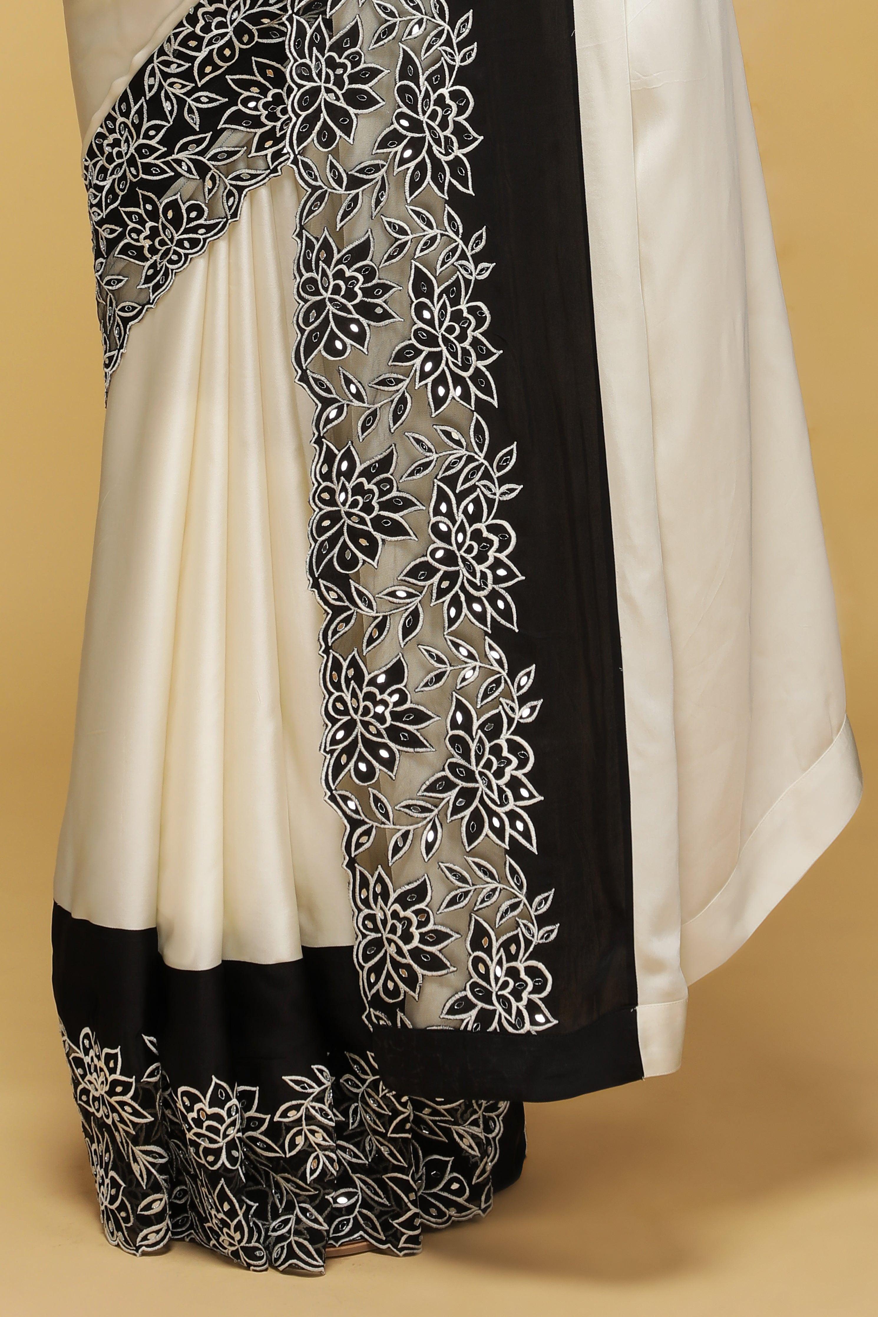 Off-White Satin Saree with Black Mirror & Thread Embroidery Border.