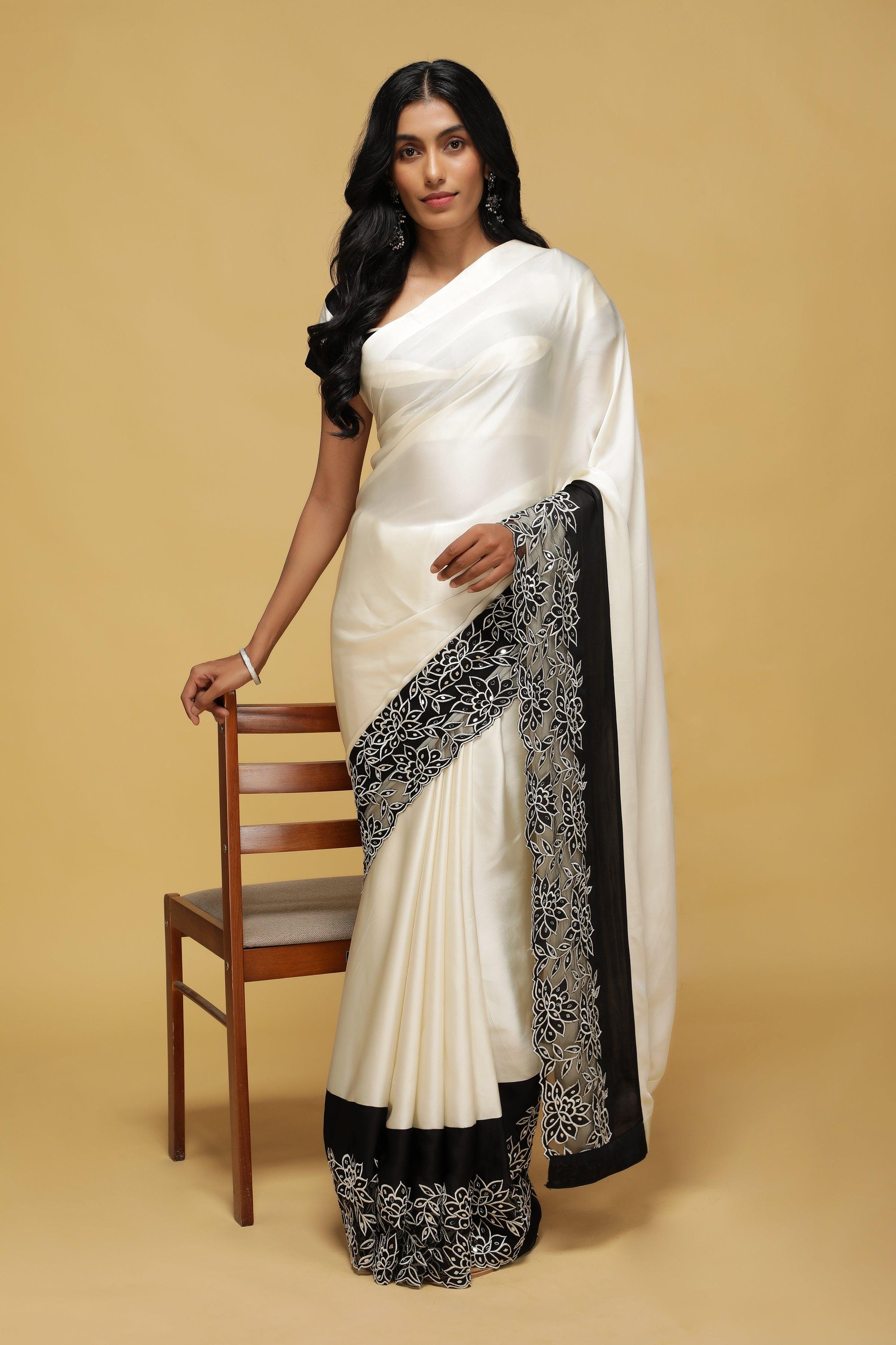 Off-White Satin Saree with Black Mirror & Thread Embroidery Border.