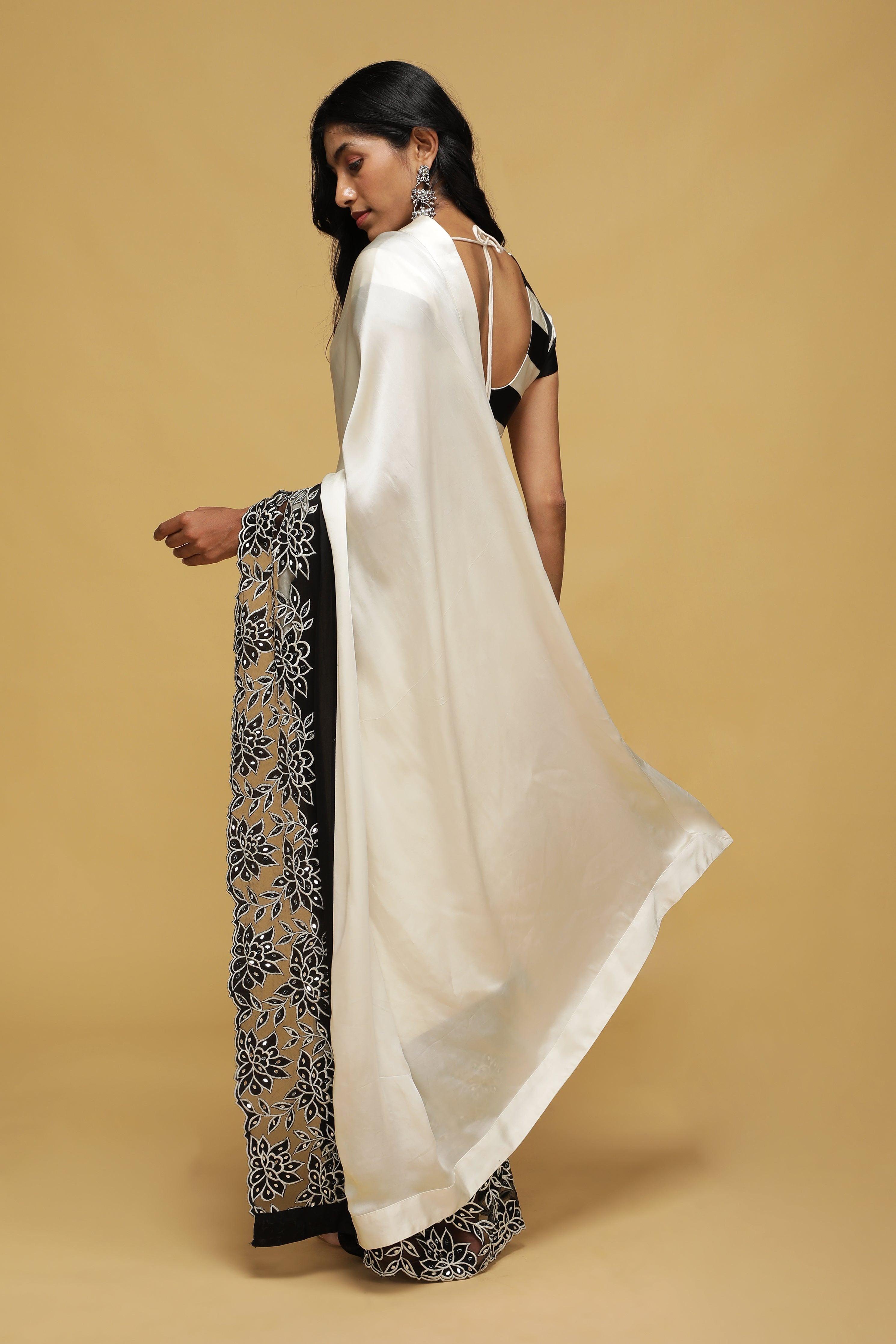 Off-White Satin Saree with Black Mirror & Thread Embroidery Border.