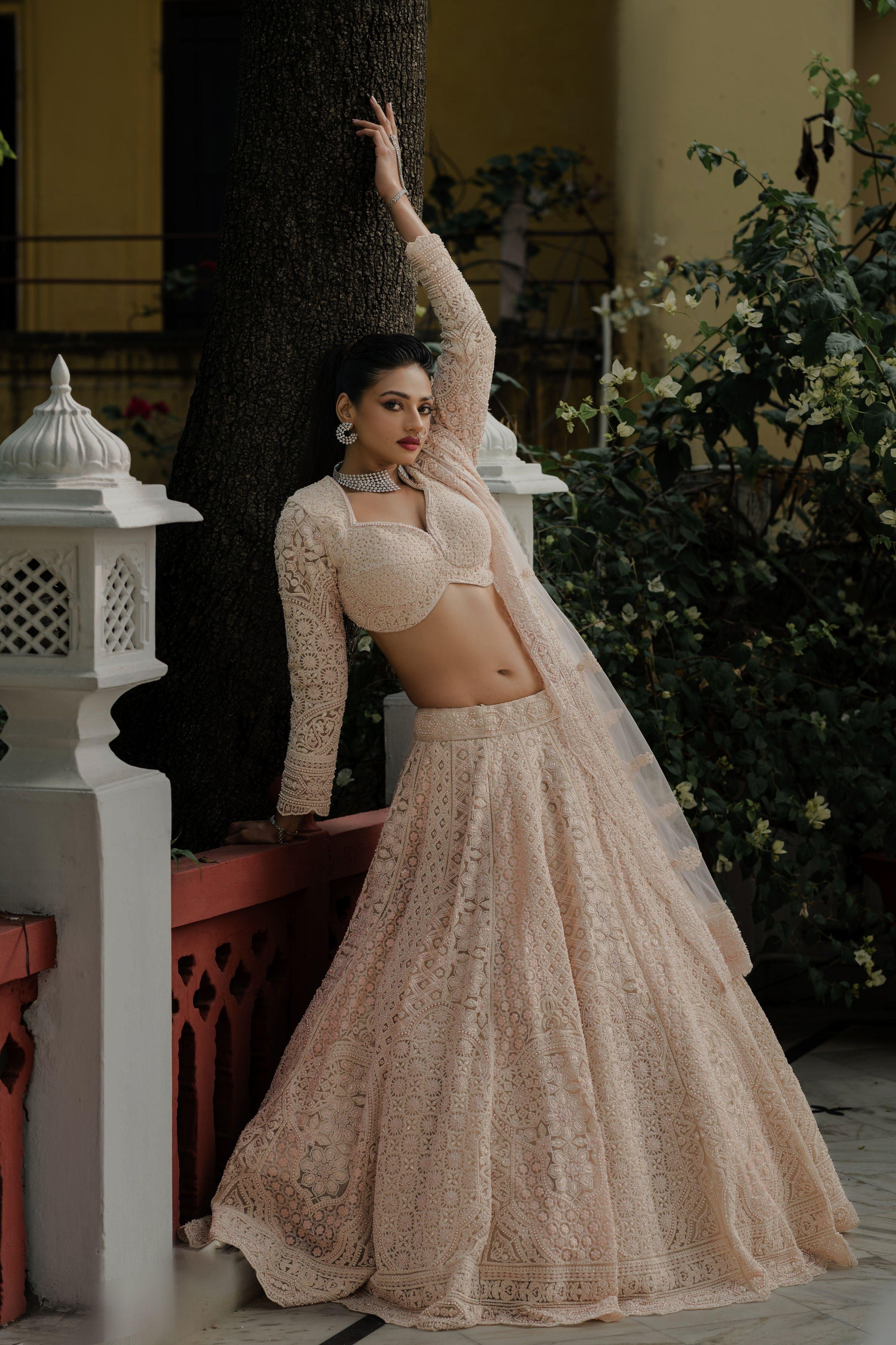Blush Peach Net Lehenga with All-Over Resham & Sequin Embroidery Mokshaa