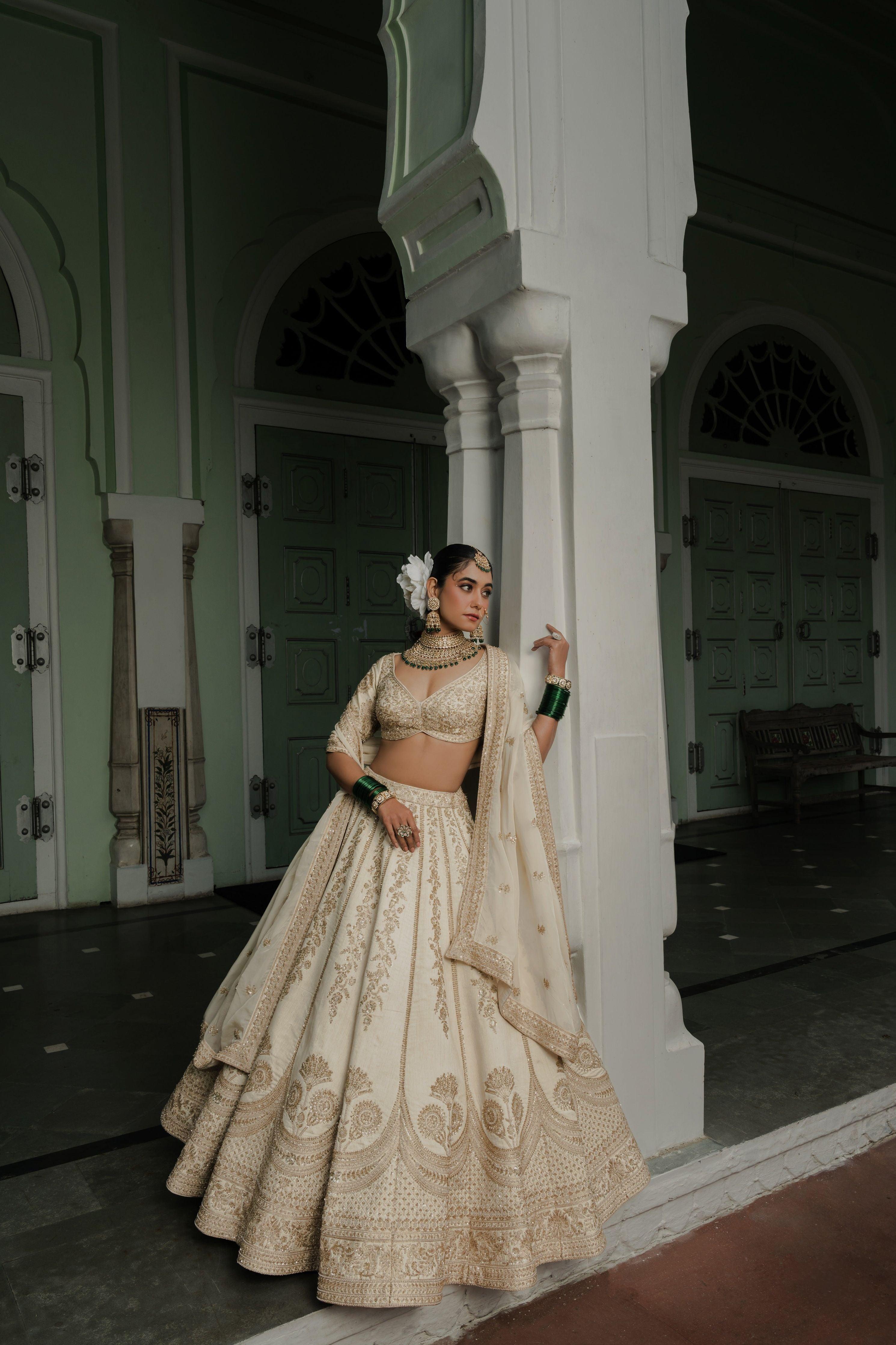 Ivory Raw Silk Lehenga with Antique Zardosi Embroidery  Mokshaa