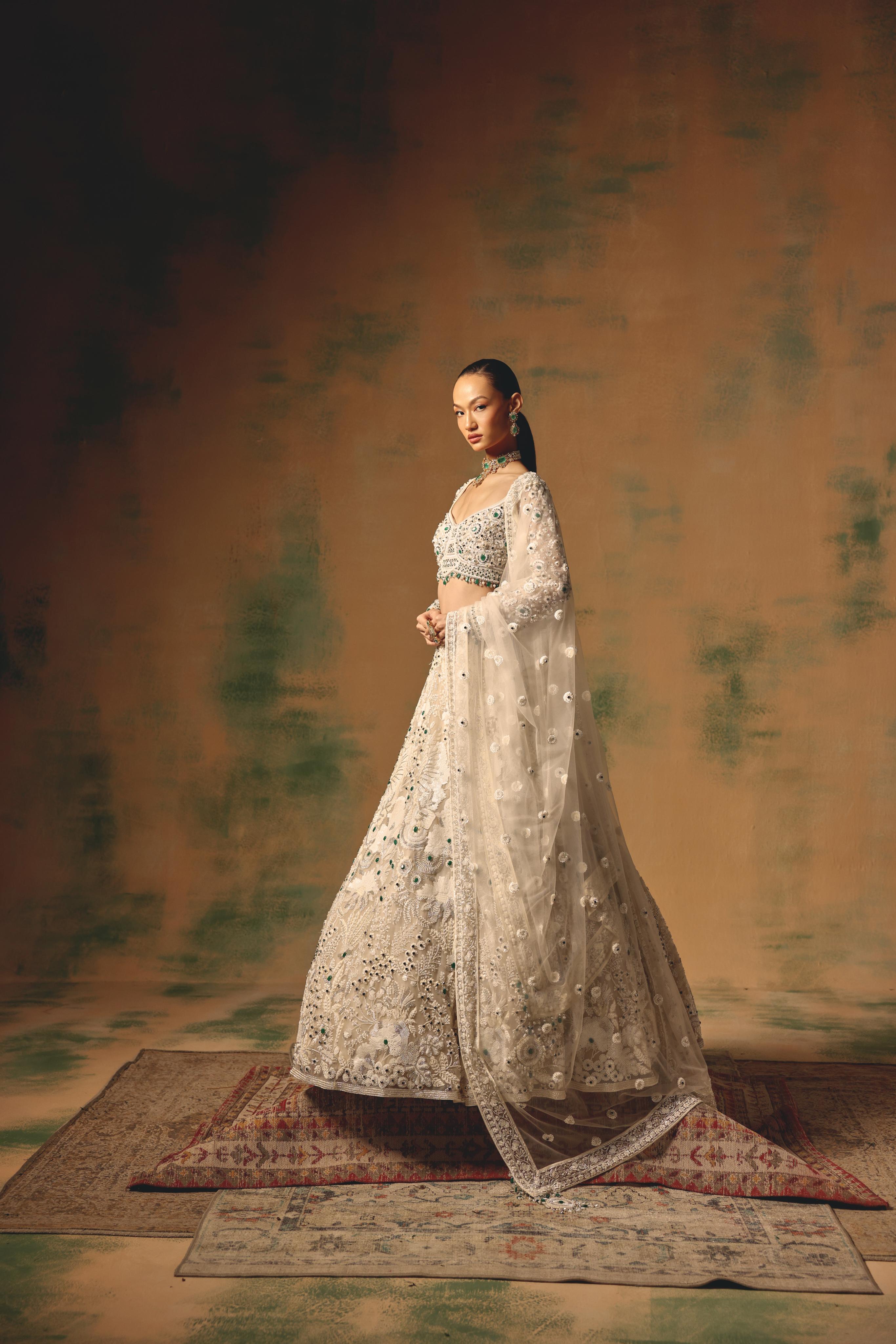 Ivory Net Lehenga with Emerald Embellishments