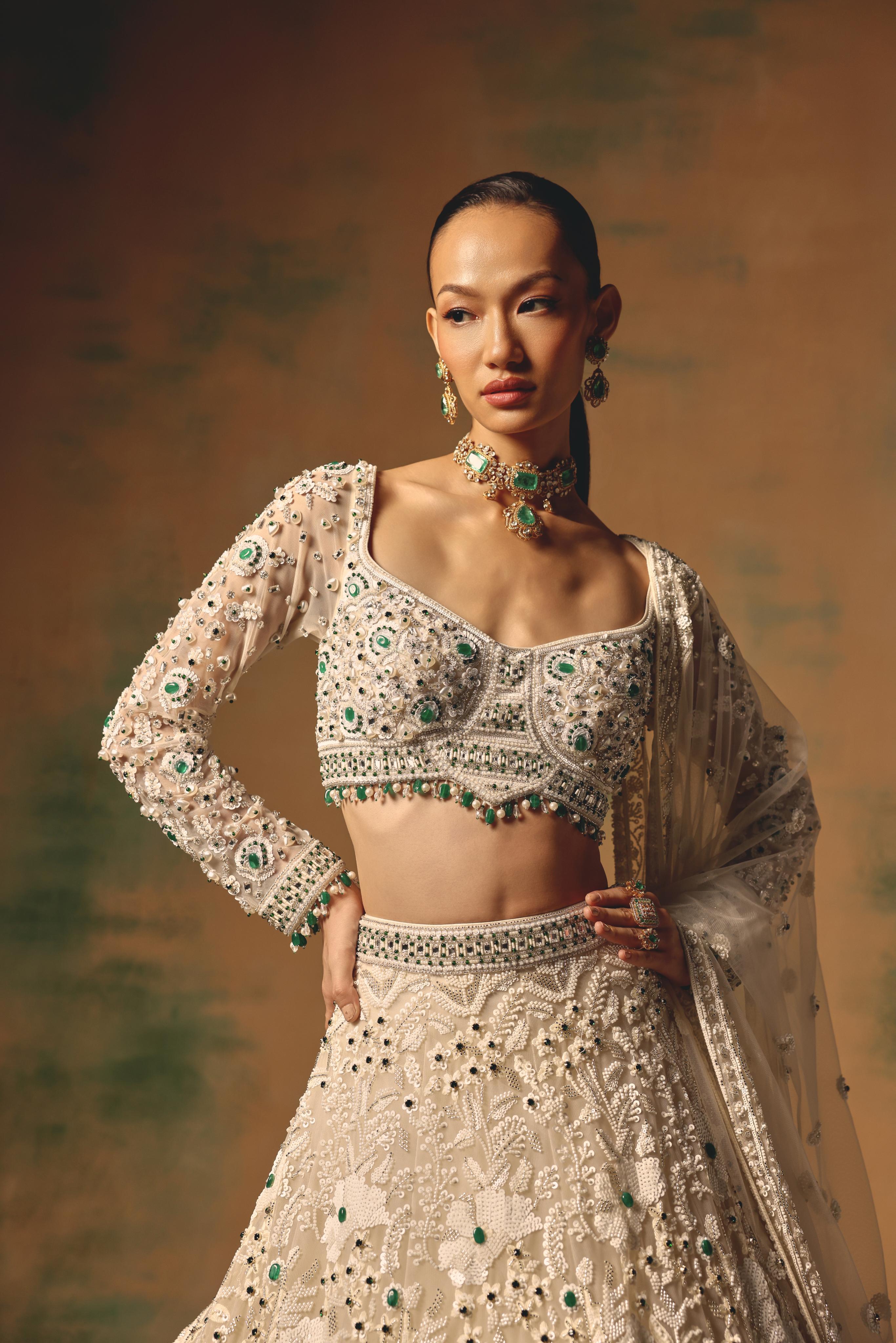 Ivory Net Lehenga with Emerald Embellishments