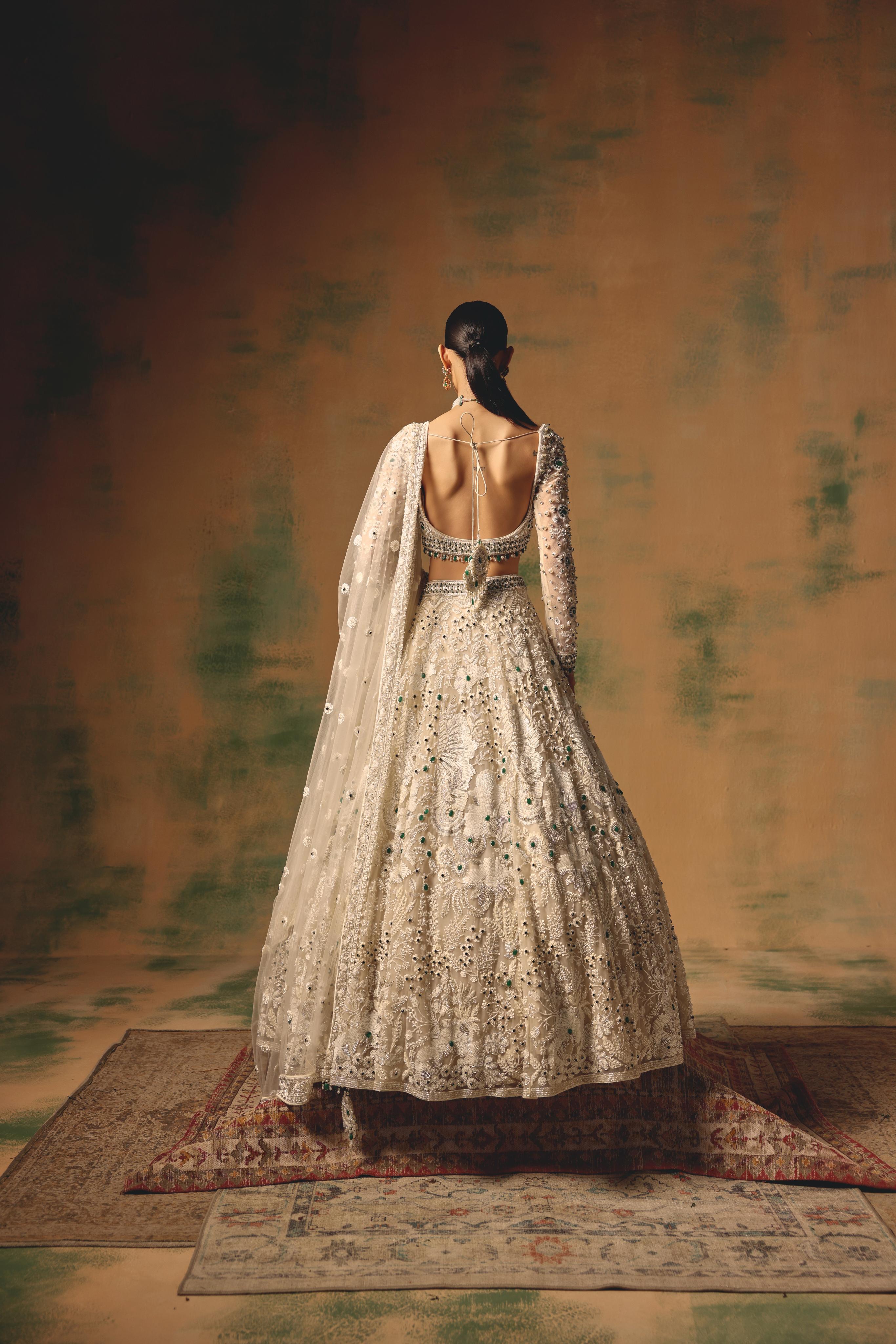 Ivory Net Lehenga with Emerald Embellishments