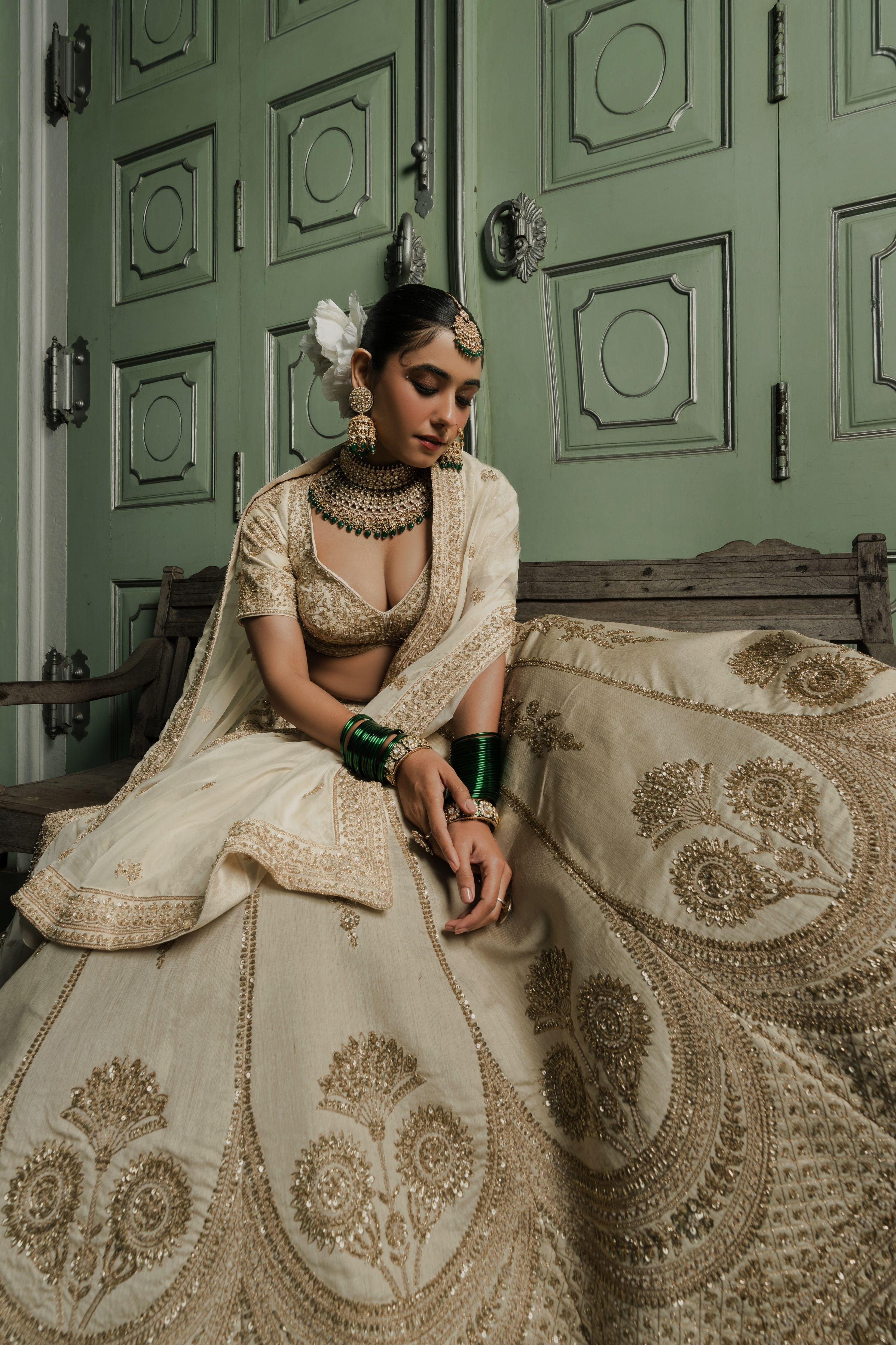 Ivory Raw Silk Lehenga with Antique Zardosi Embroidery  Mokshaa