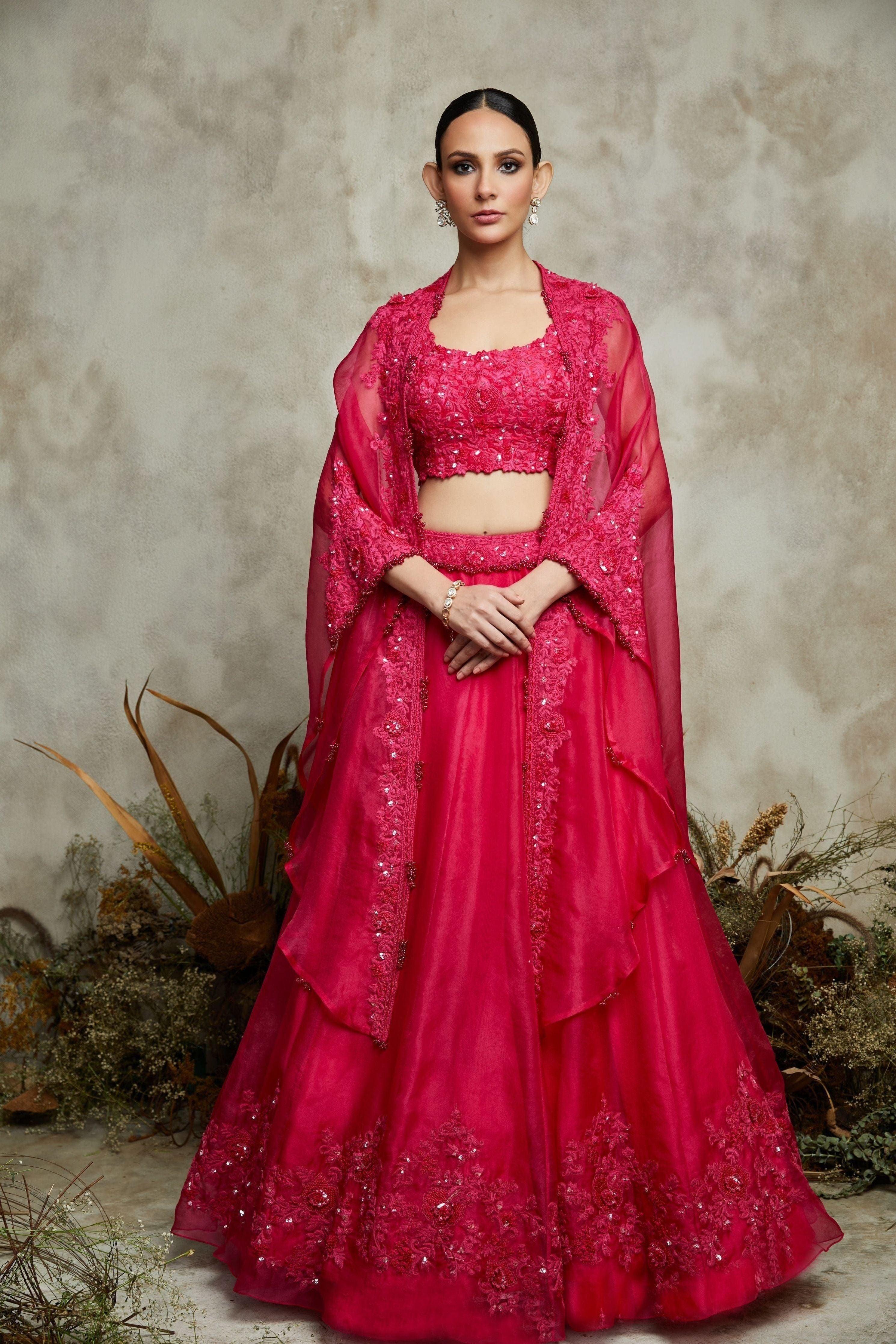 Fuscia silk blouse with organza cape and lehenga  Mokshaa