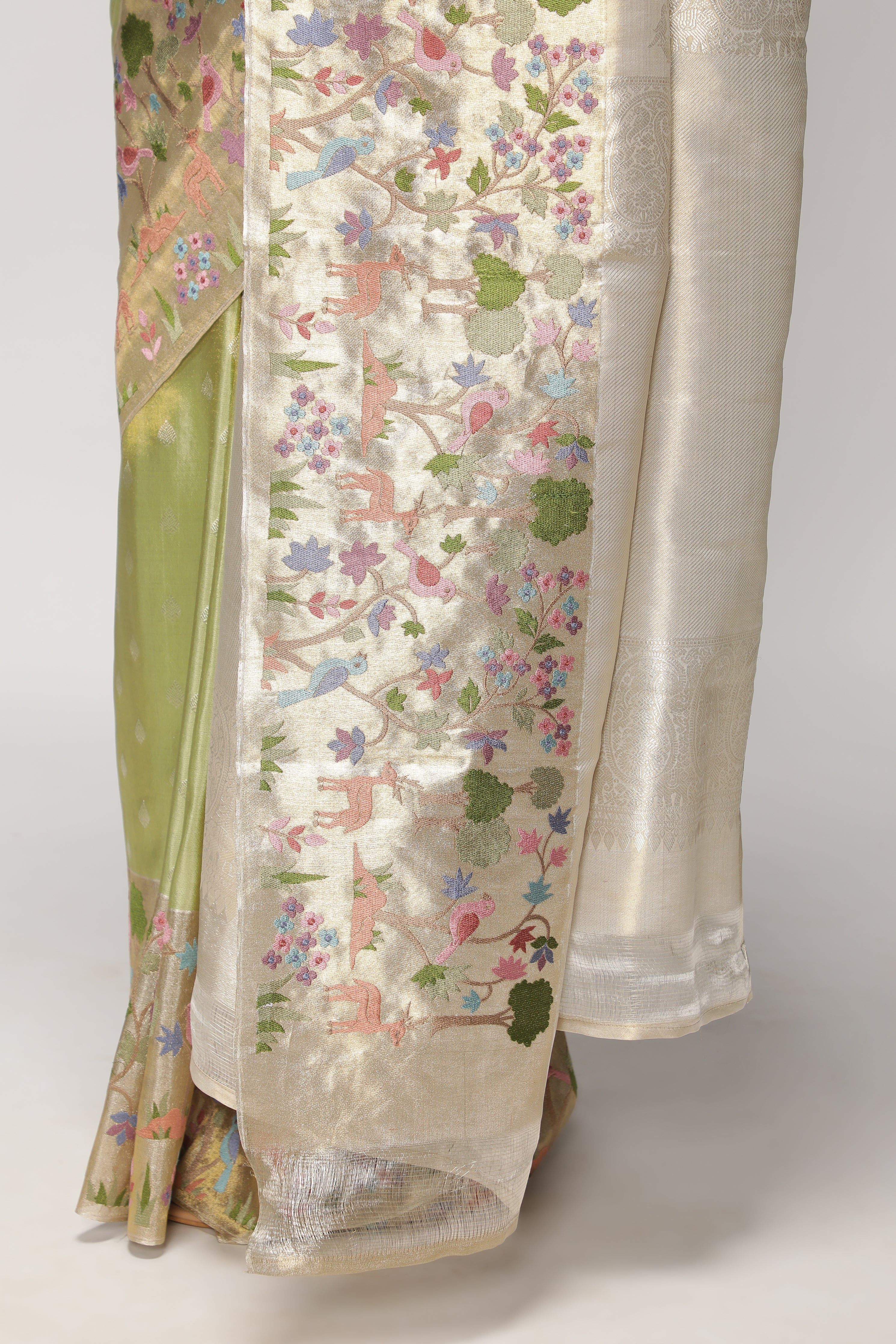 Green Kanchipuram Tissue Silk Saree with All-Over Zari Weaving and Contrast Embroidery Border