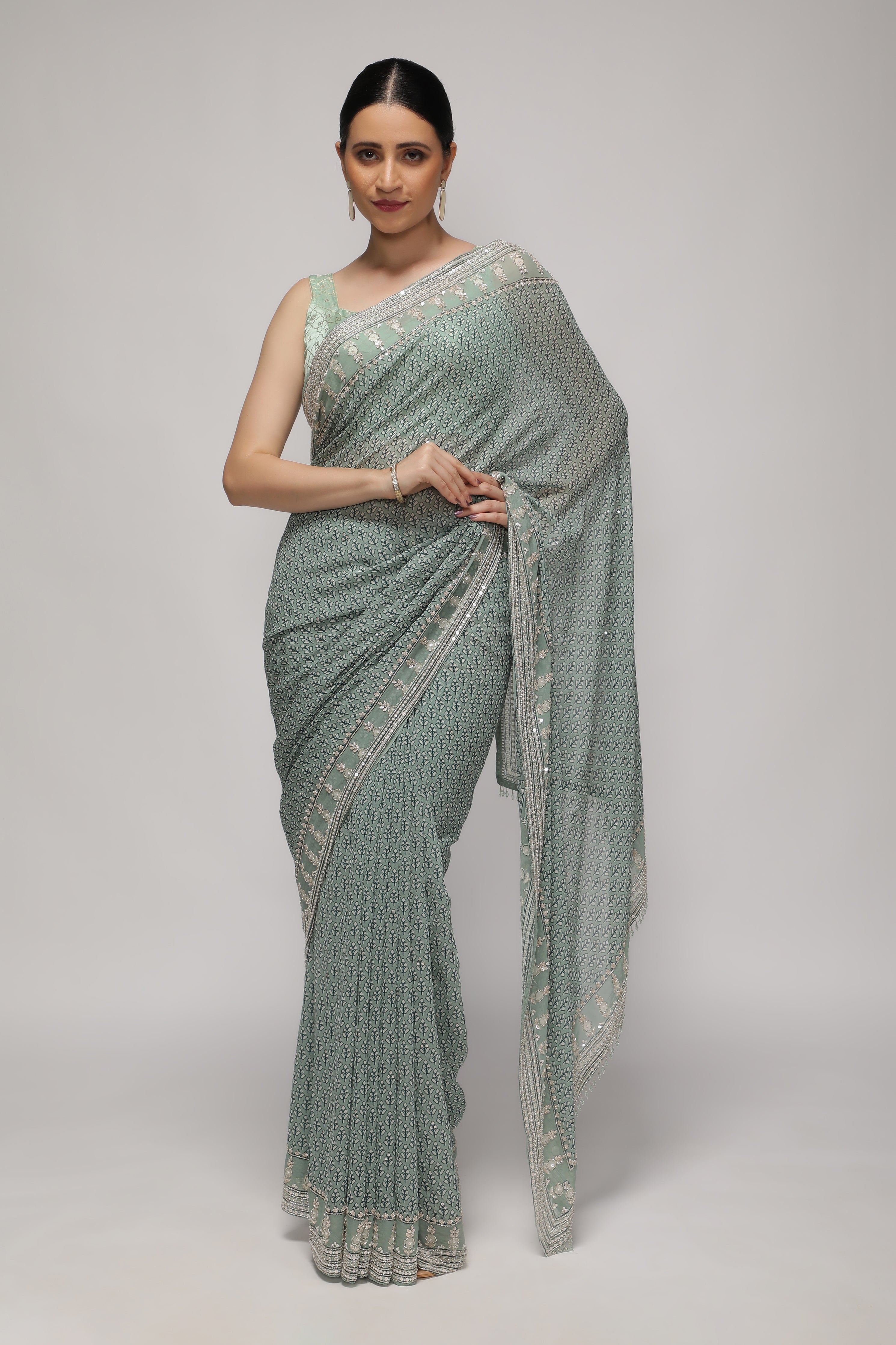 Mint Blue Georgette Saree with Printed Sequins Highlight Body and Sequins Border