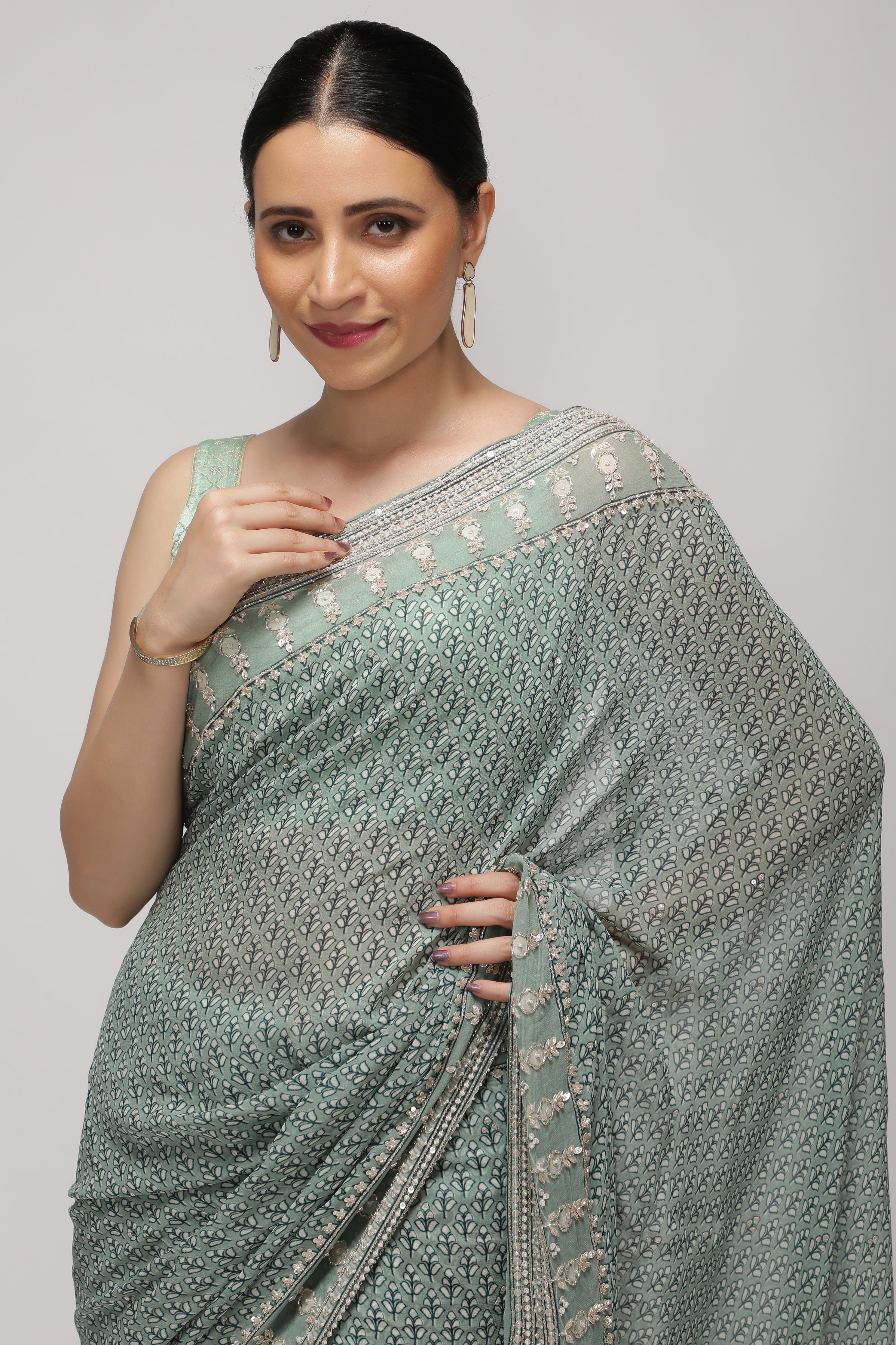 Mint Blue Georgette Saree with Printed Sequins Highlight Body and Sequins Border