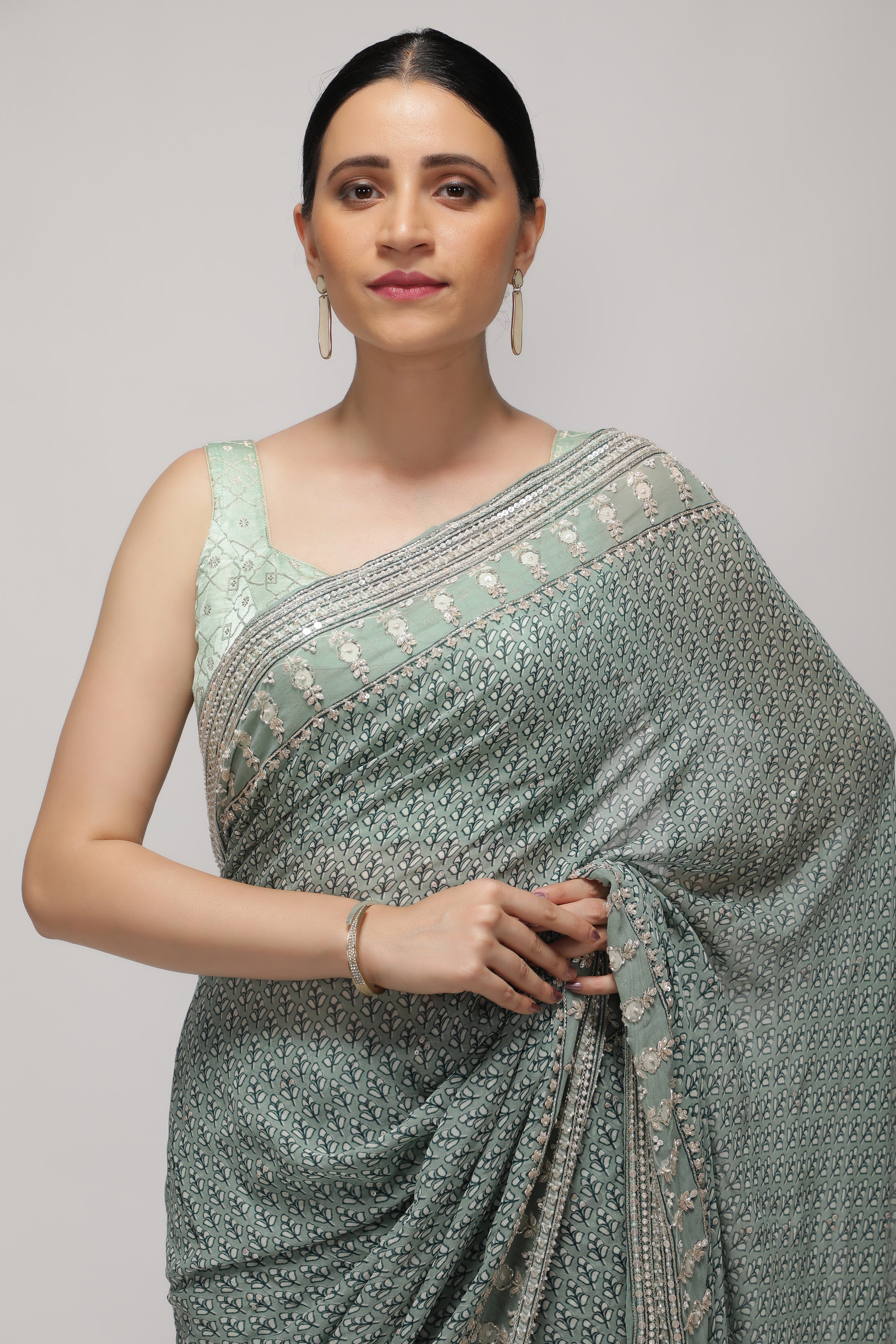 Mint Blue Georgette Saree with Printed Sequins Highlight Body and Sequins Border