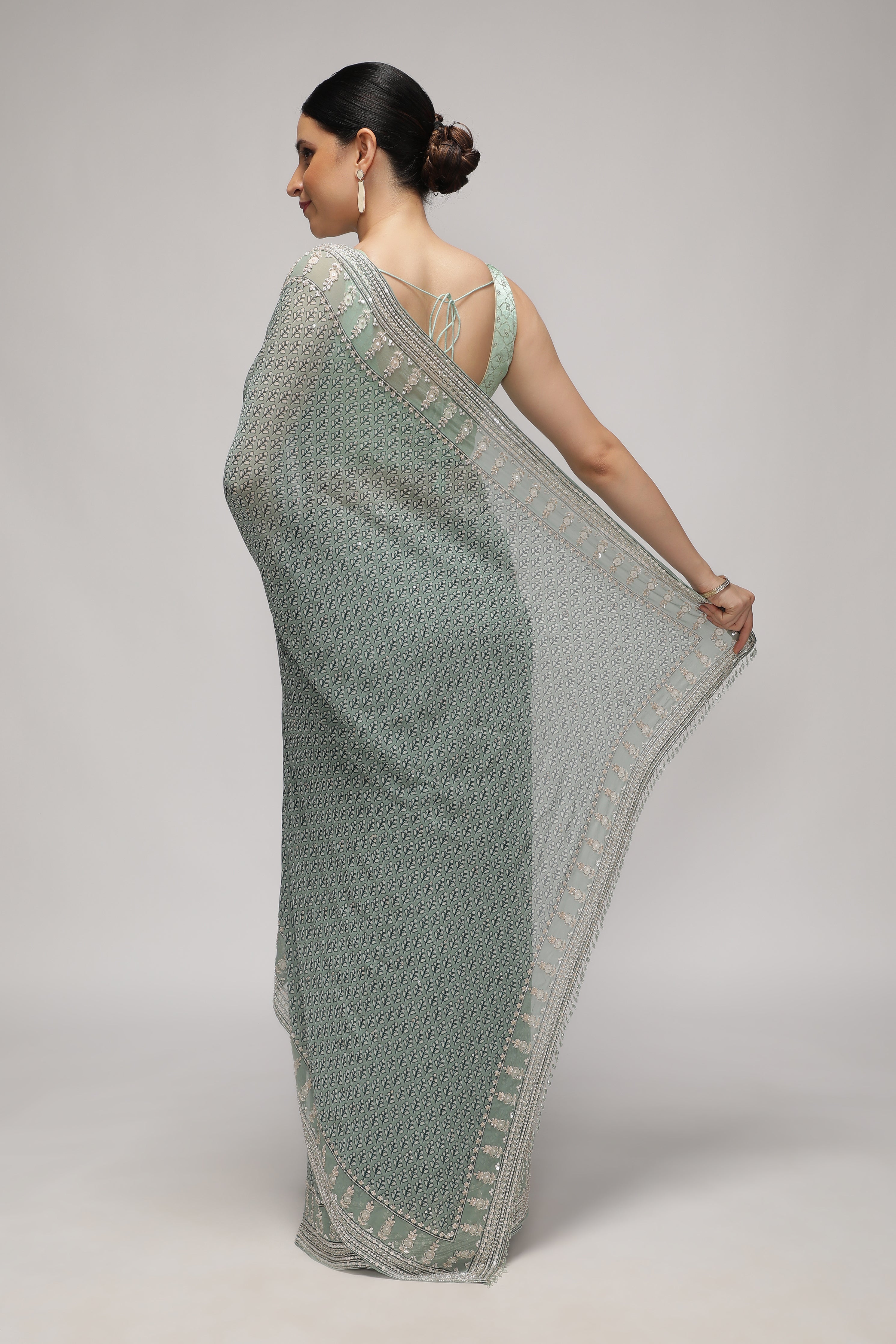 Mint Blue Georgette Saree with Printed Sequins Highlight Body and Sequins Border