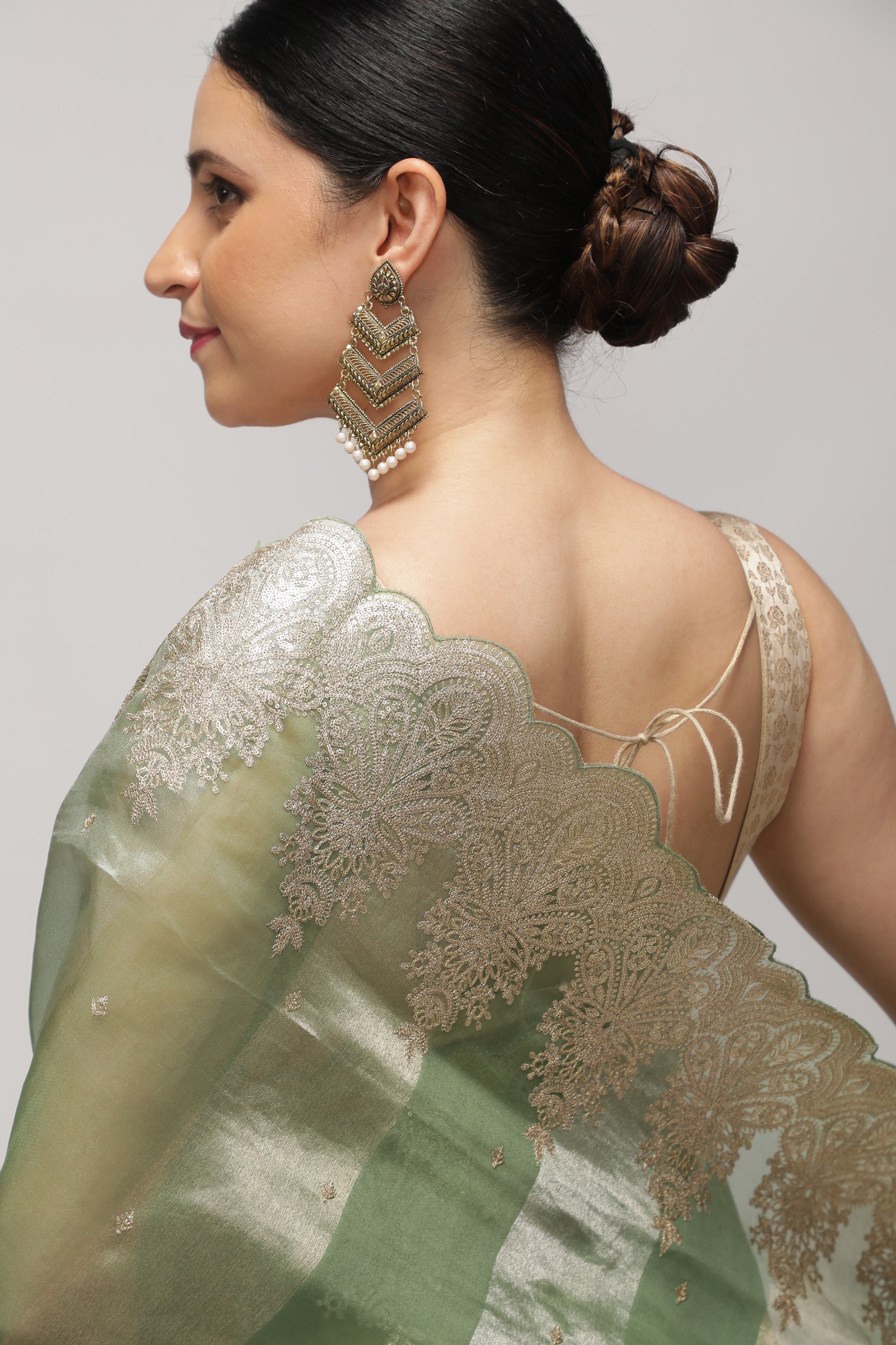Mint Green Organza Saree with Zari Stripes, Sequins Highlight & Zari-Embroidered Border