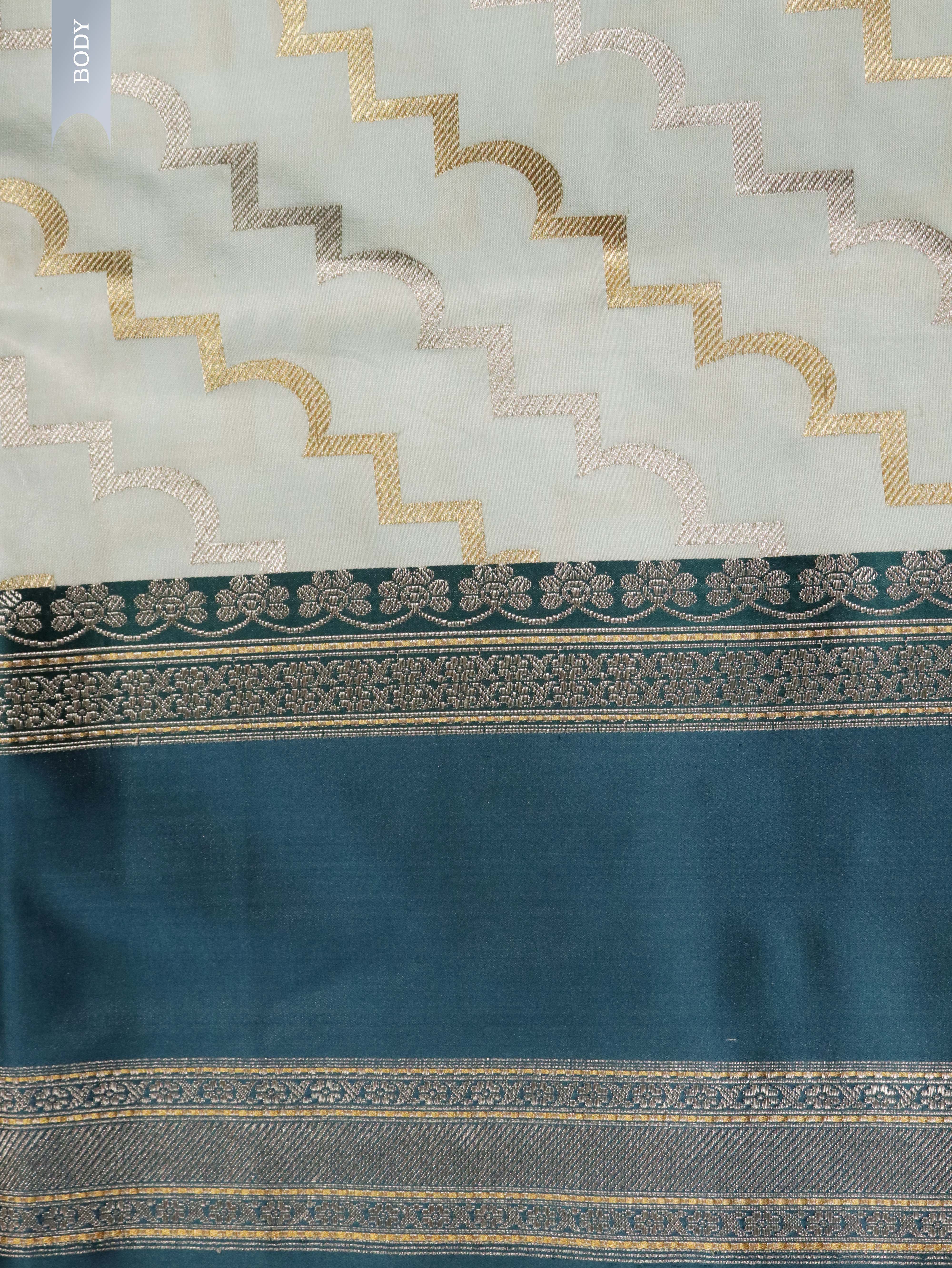 Light Blue Banarasi Silk Saree with Silver–Gold Zig-Zag Weave & Contrast Satin Border