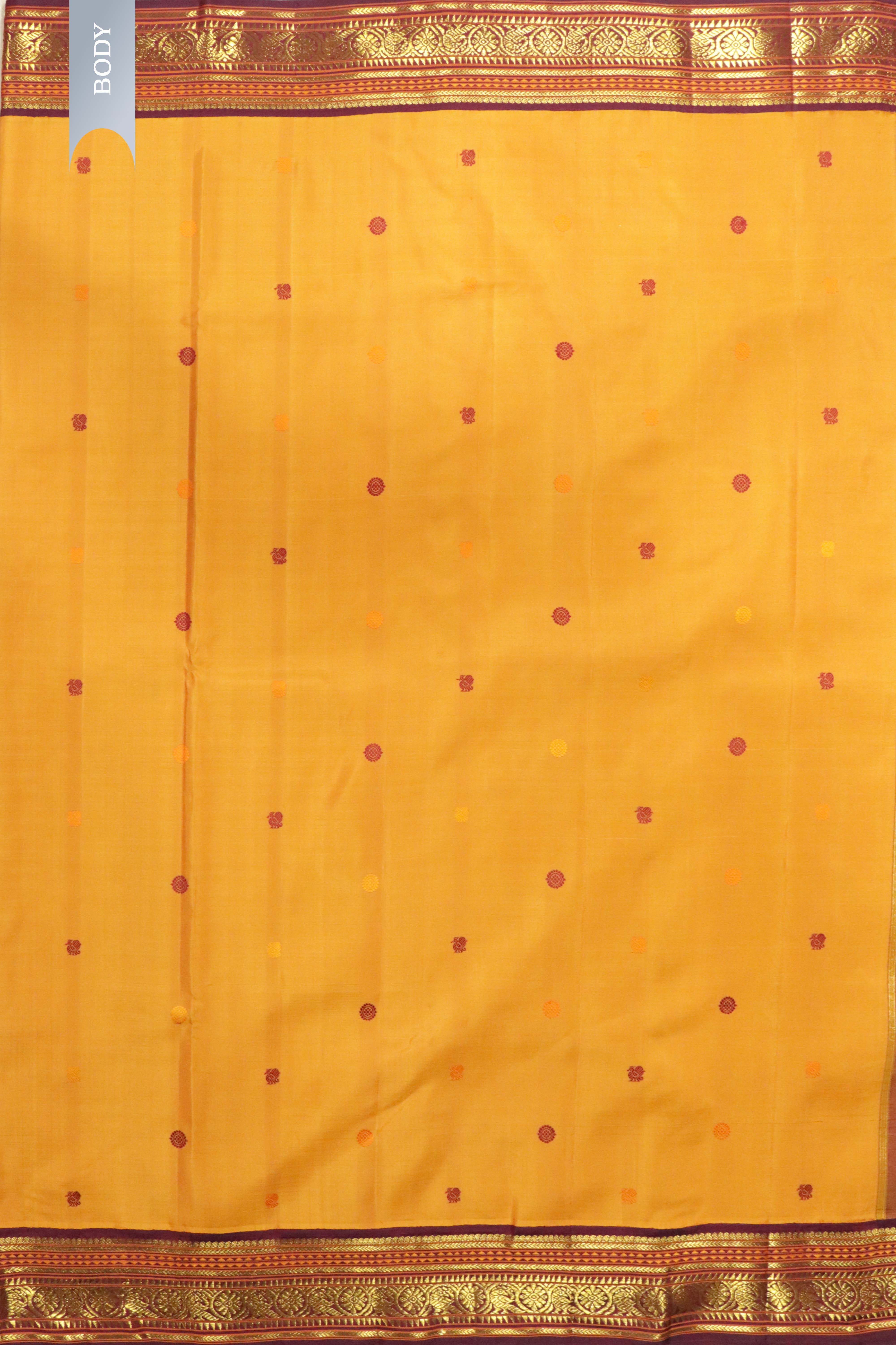 Pastel Orange Kanchipuram Silk Saree with Silk Thread Motifs & Contrast Zari Border